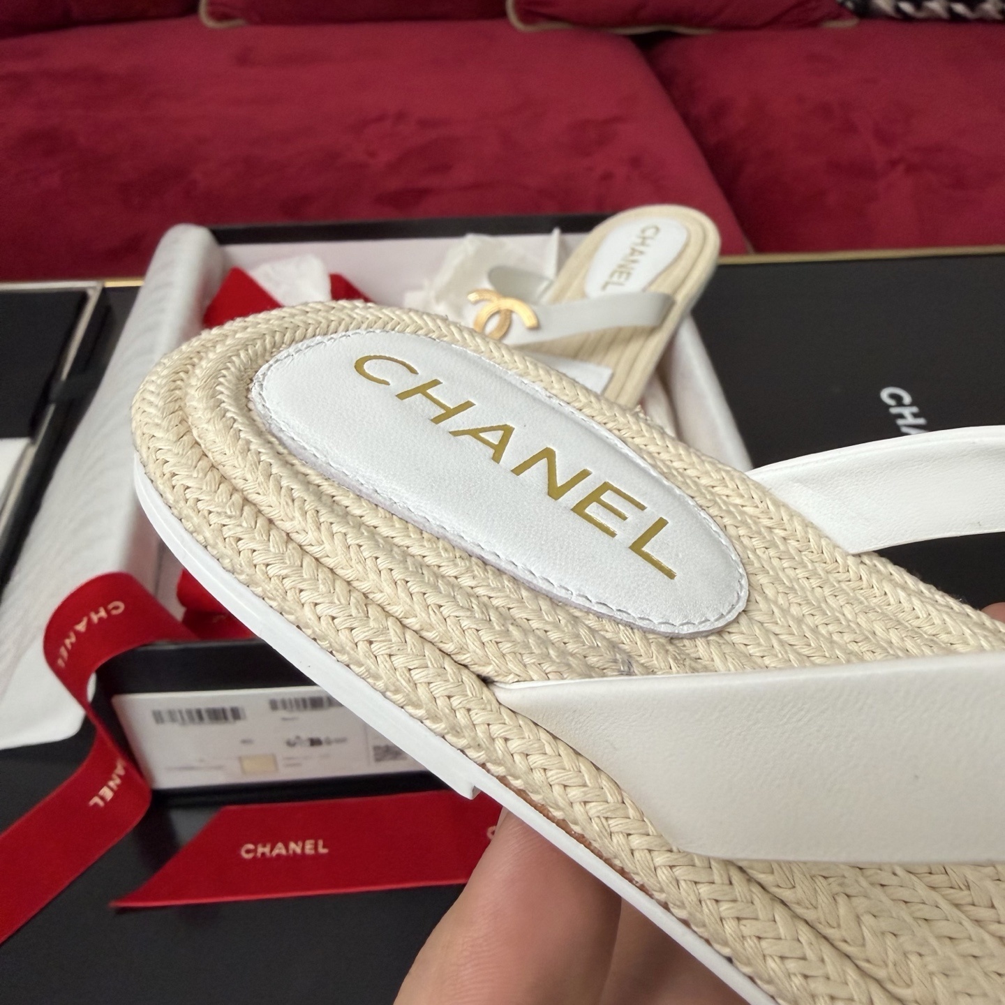 Luxury Chanel white leather thong sandals with gold interlocking CC logo and woven espadrille soles in original packaging. - Hình 7