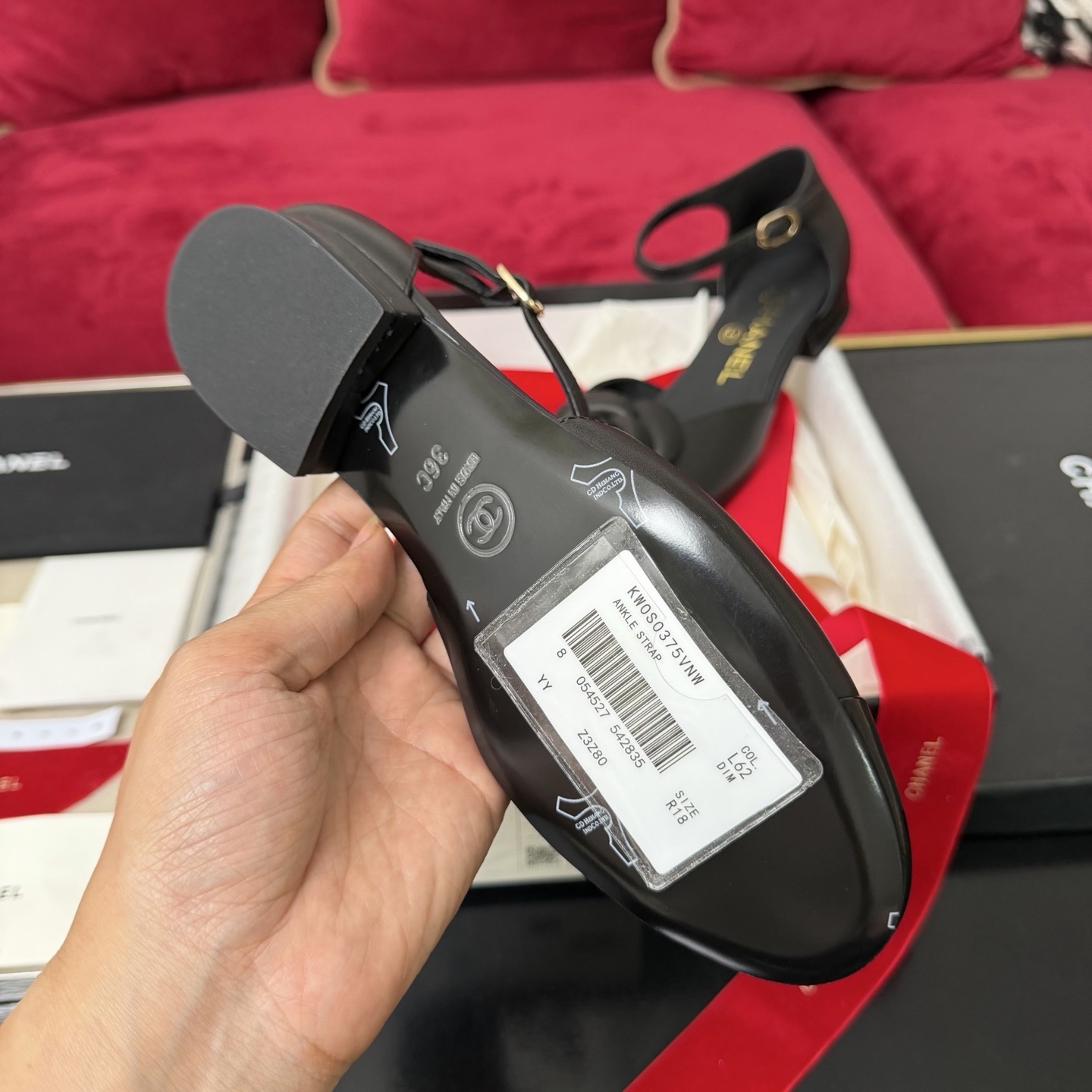 Pair of black Chanel ankle strap flats featuring a large camellia flower and patent leather toe cap in a luxury gift box. - Hình 9