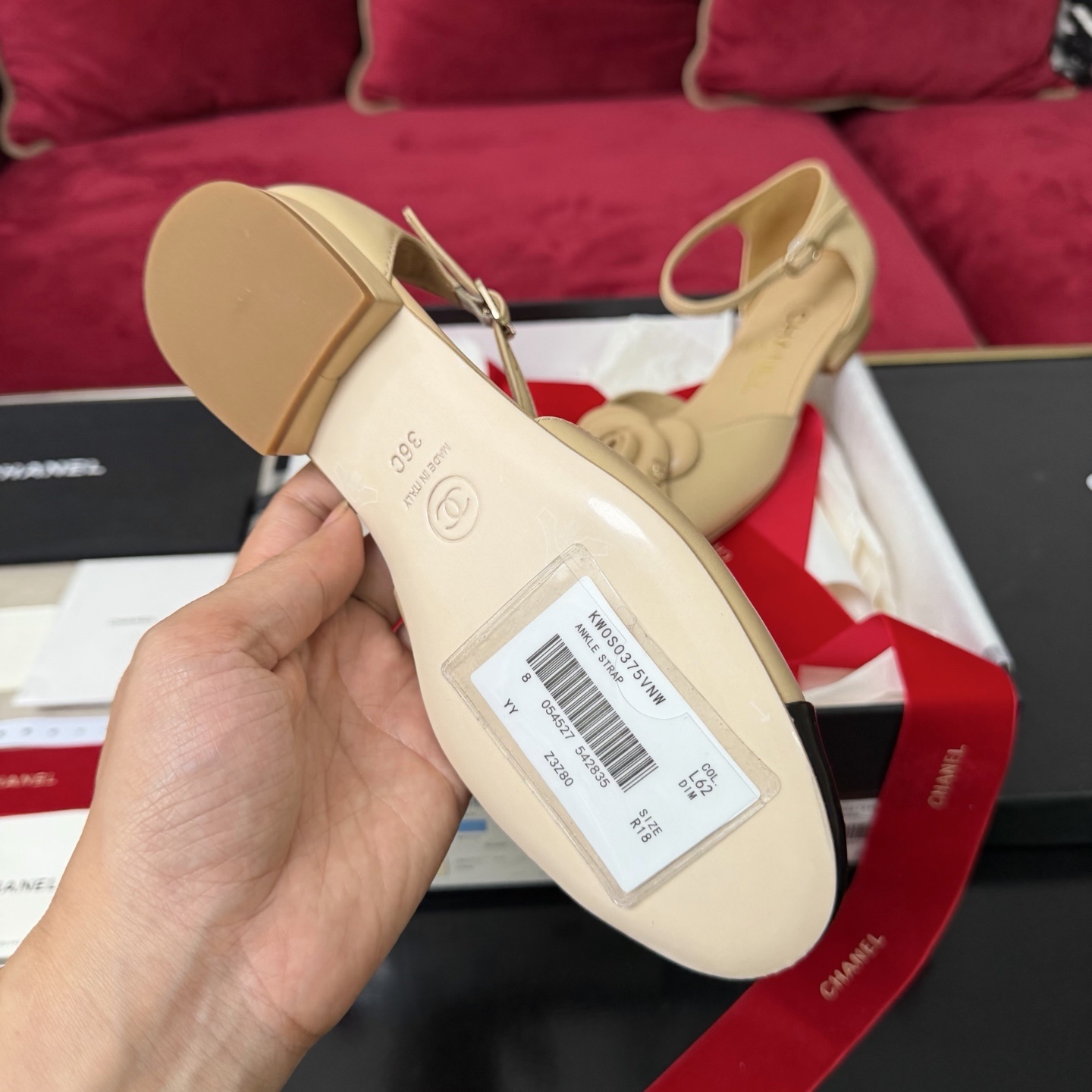 Luxury beige and black two-tone ankle strap shoes with a large camellia flower detail on the toe. - Hình 9