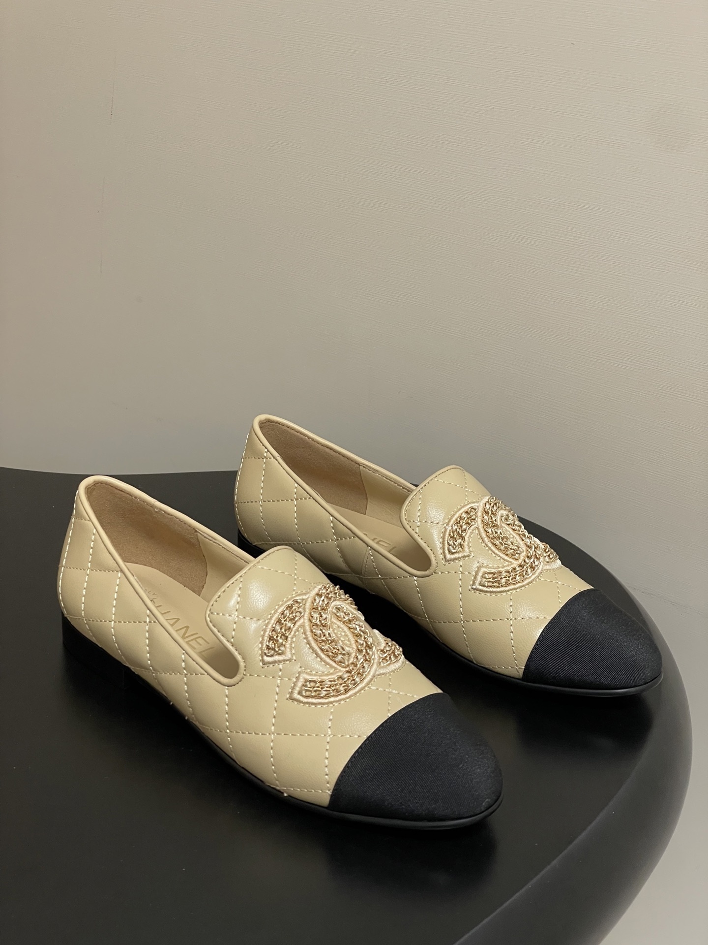Chanel Quilted Leather Loafers with Black Cap Toe and Gold CC Logo