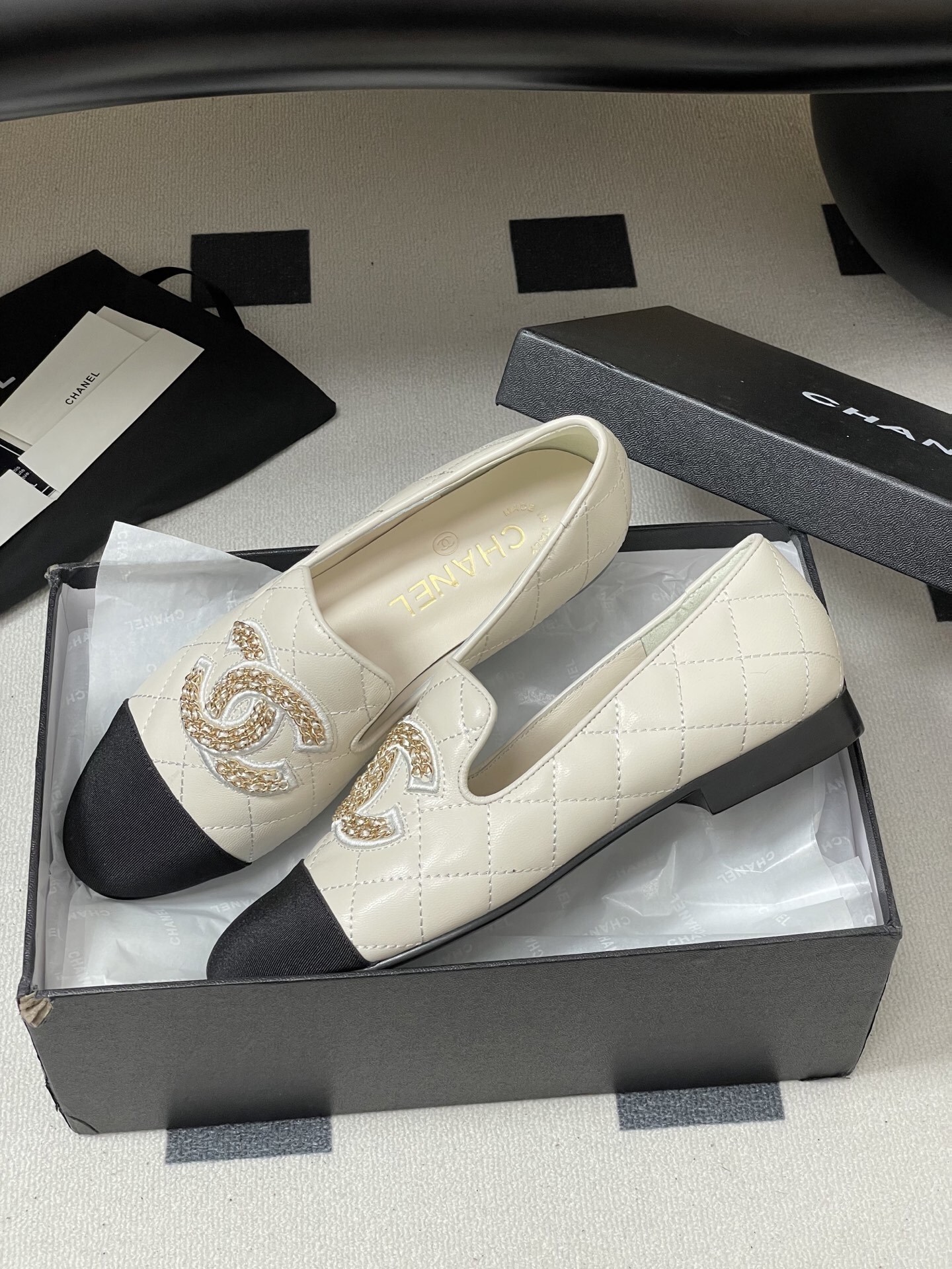 Chanel Two-Tone Quilted Leather Loafers - Elegant CC Chain Flats