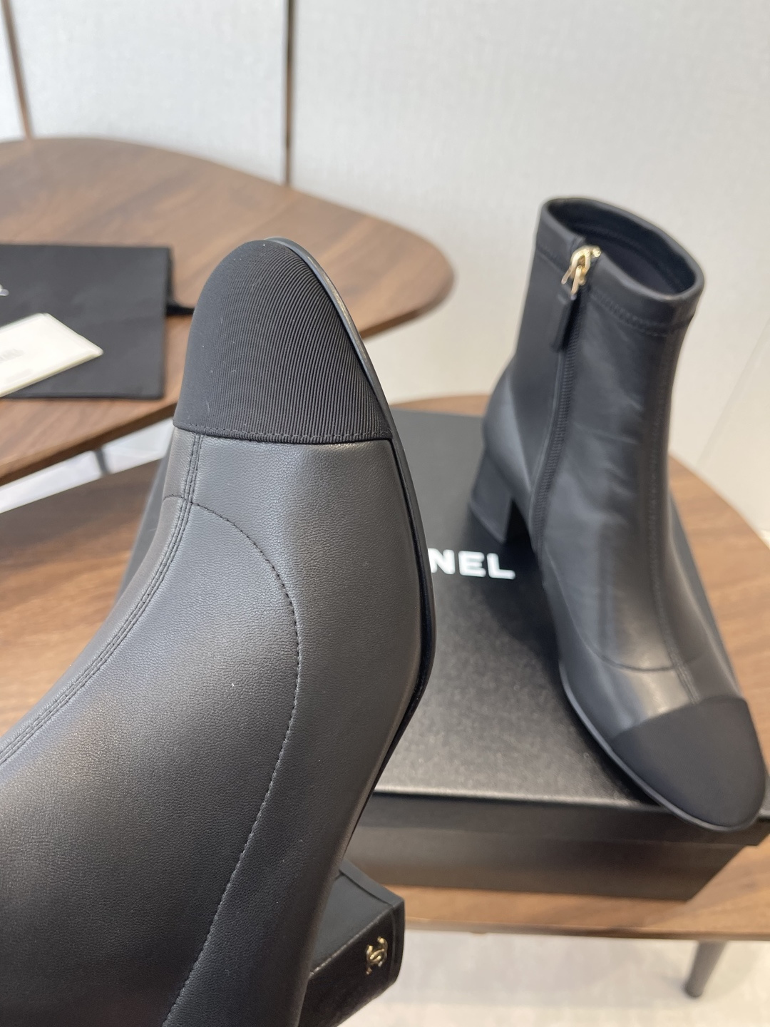 Chanel Luxury Black Leather Ankle Boots with Cap Toe CC Heel