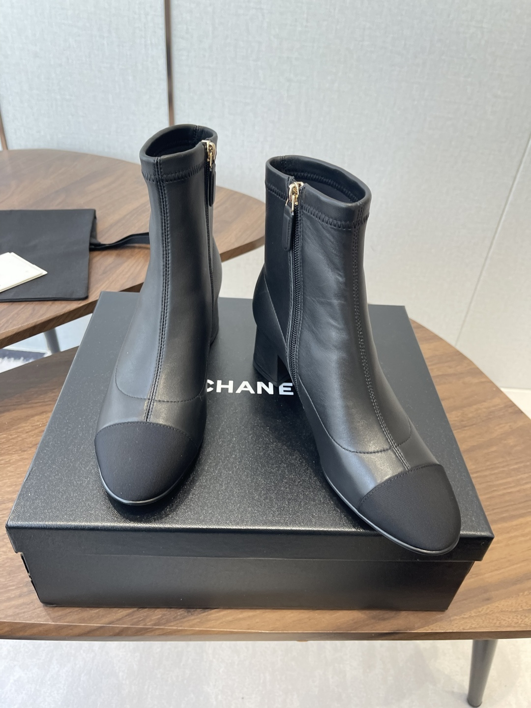 Chanel Luxury Black Leather Ankle Boots with Cap Toe CC Heel