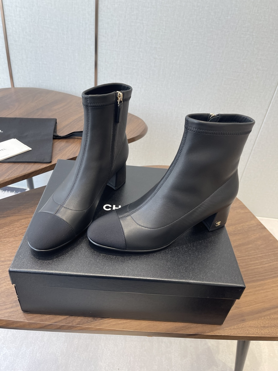 Chanel Luxury Black Leather Ankle Boots with Cap Toe CC Heel