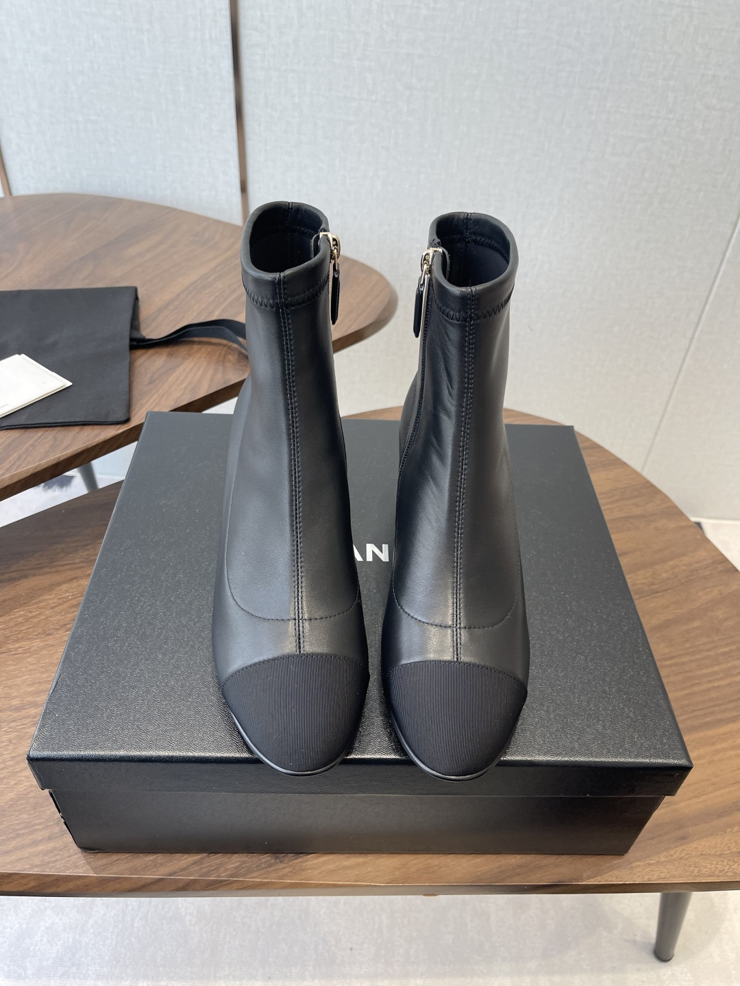 Chanel Luxury Black Leather Ankle Boots with Cap Toe CC Heel