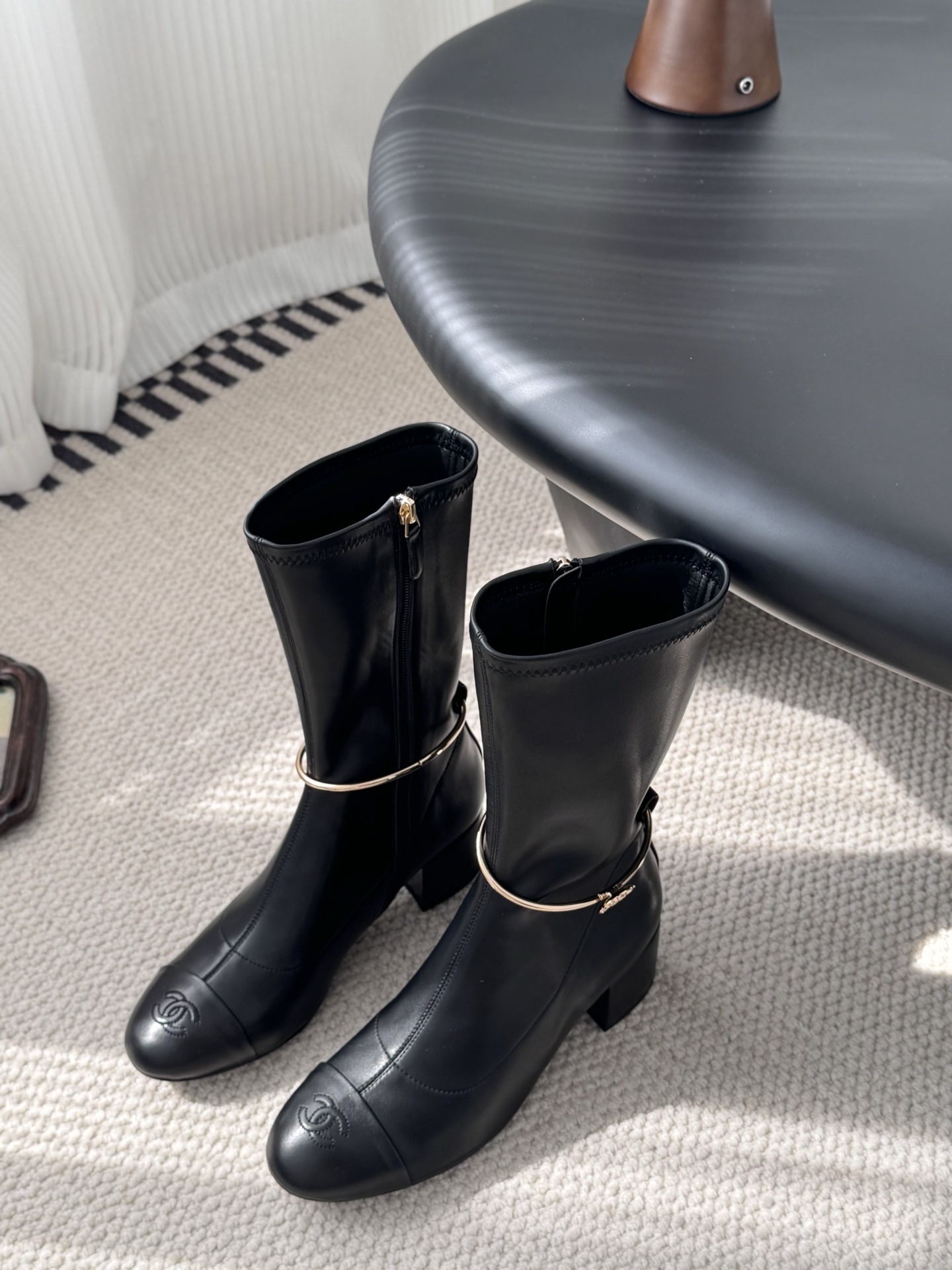 Elegant Black Leather Mid-Calf Boots with Gold Charm Detail