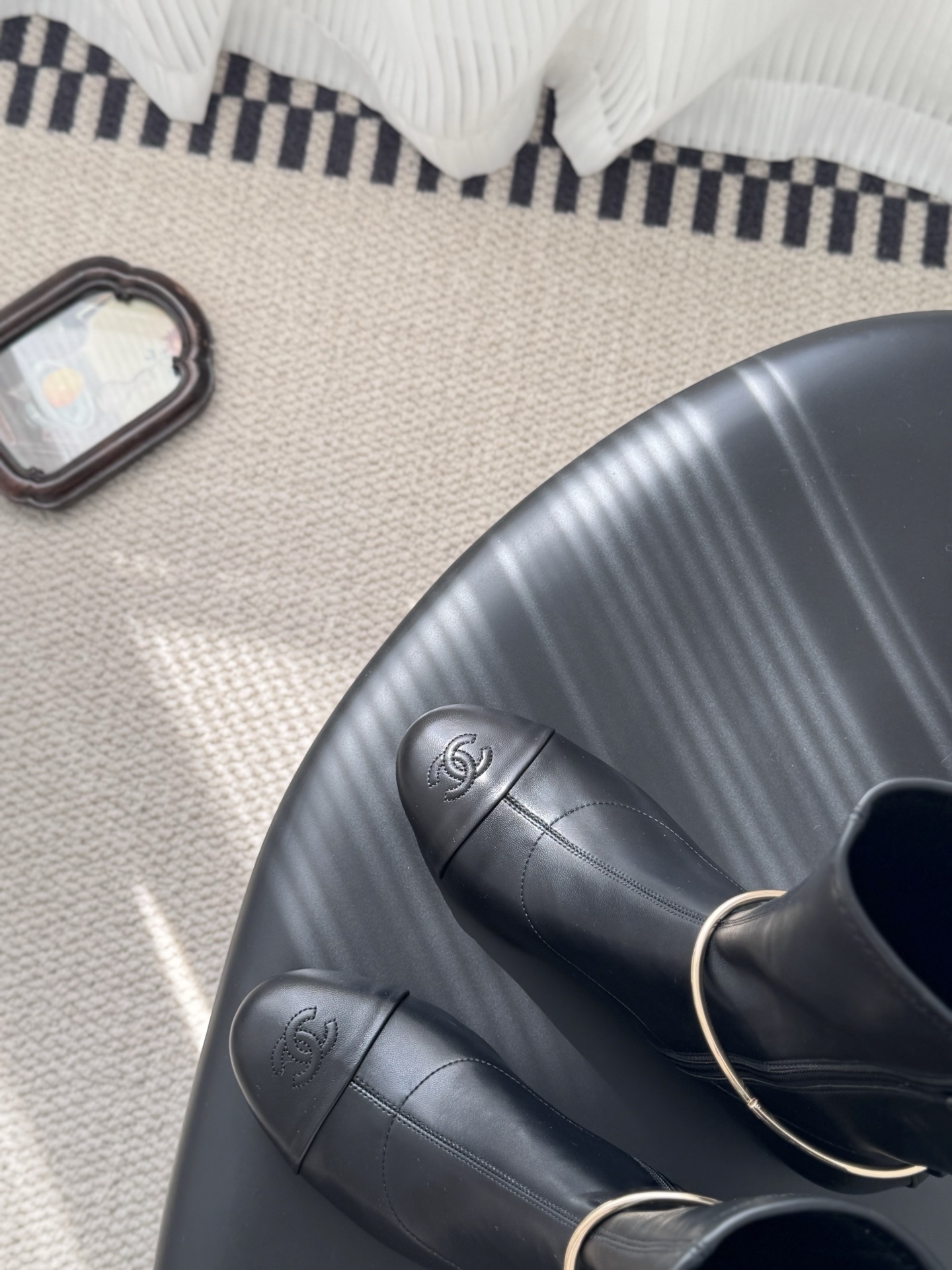 Elegant Black Leather Mid-Calf Boots with Gold Charm Detail