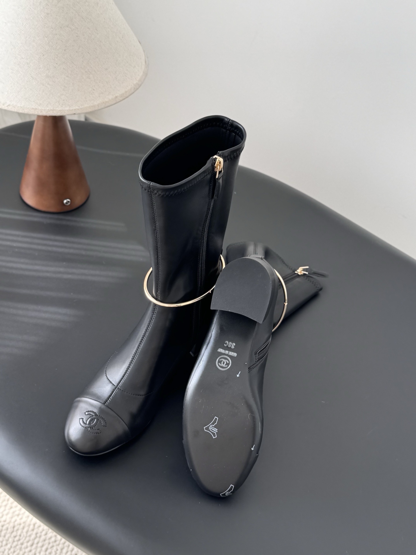 Elegant Black Leather Mid-Calf Boots with Gold Charm Detail