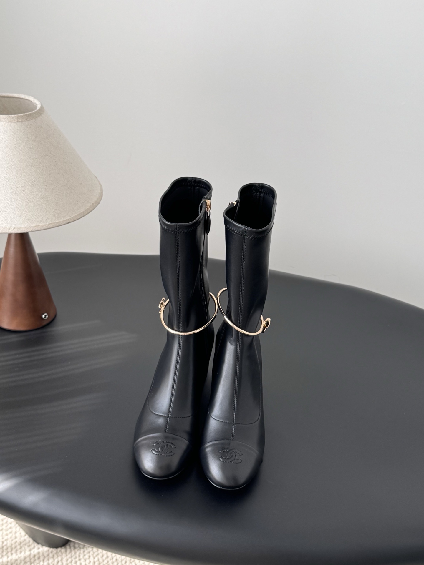 Elegant Black Leather Mid-Calf Boots with Gold Charm Detail