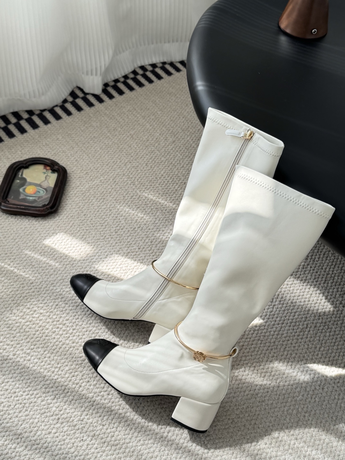 Elegant White Knee-High Boots with Black Toe Cap & Gold Detail
