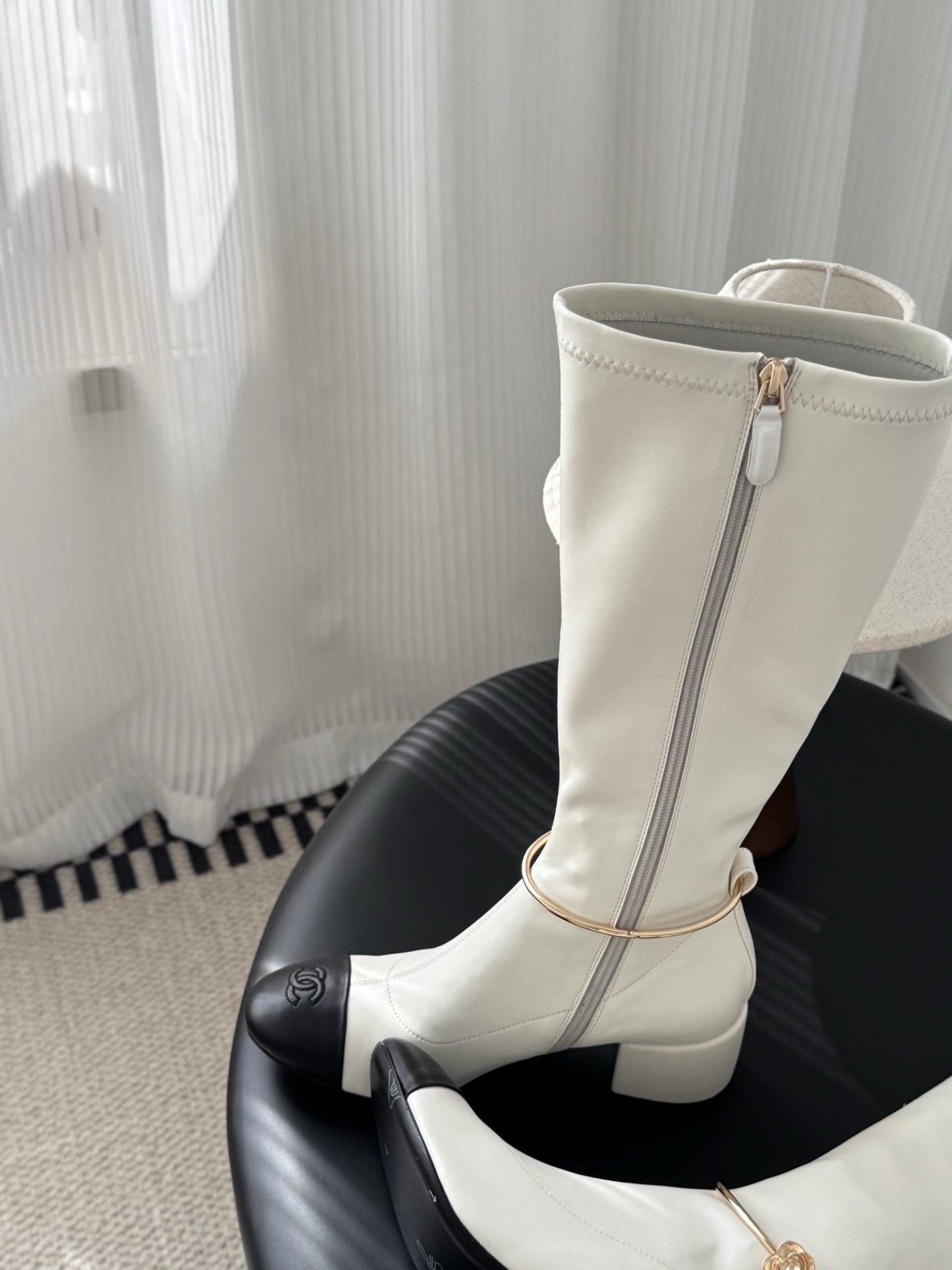 Elegant White Knee-High Boots with Black Toe Cap & Gold Detail