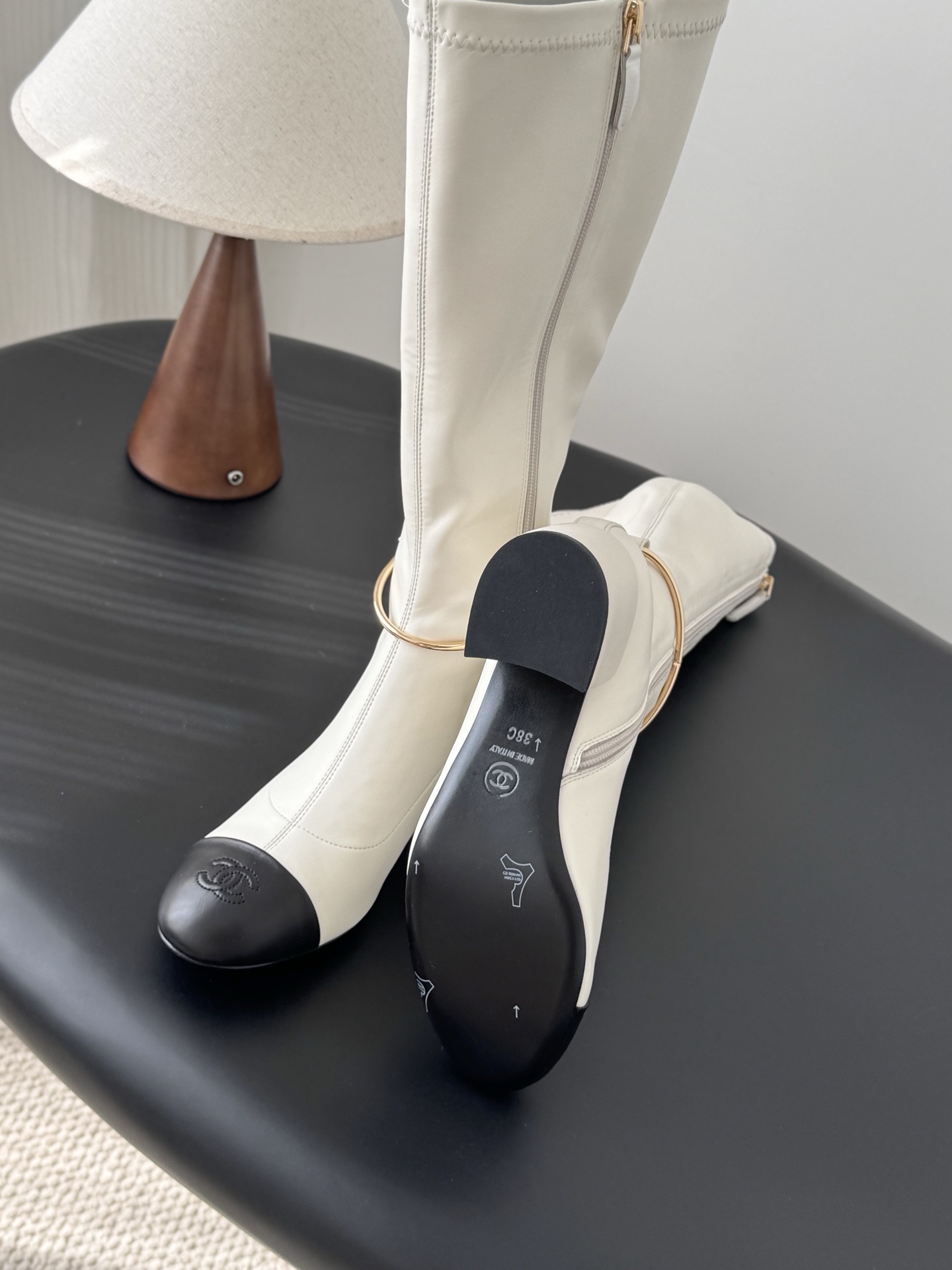 Elegant White Knee-High Boots with Black Toe Cap & Gold Detail