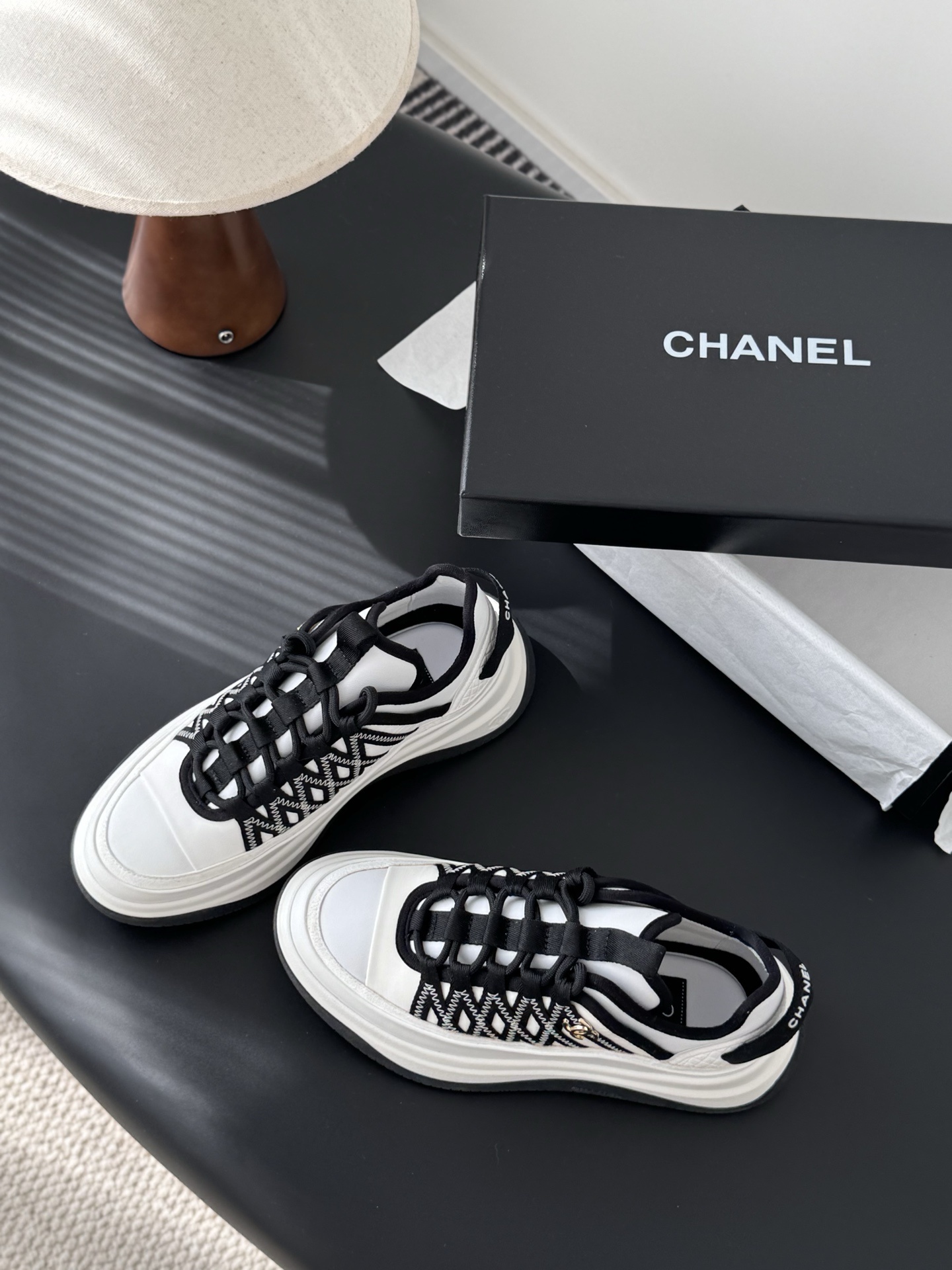 Chanel Luxury Black and White Sneakers with Gold CC Logo