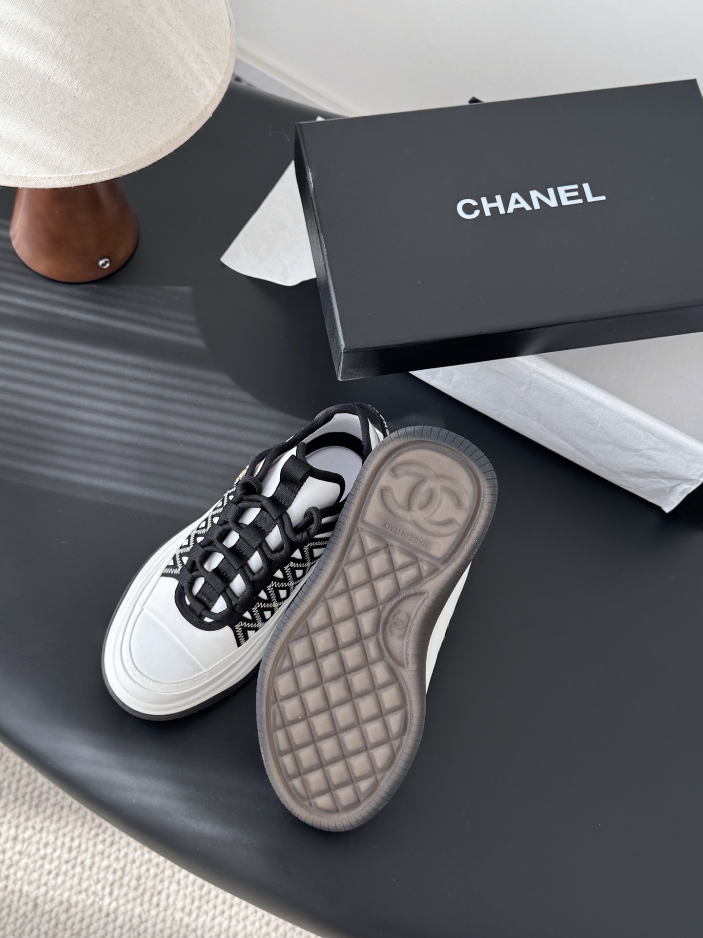 Chanel Luxury Black and White Sneakers with Gold CC Logo