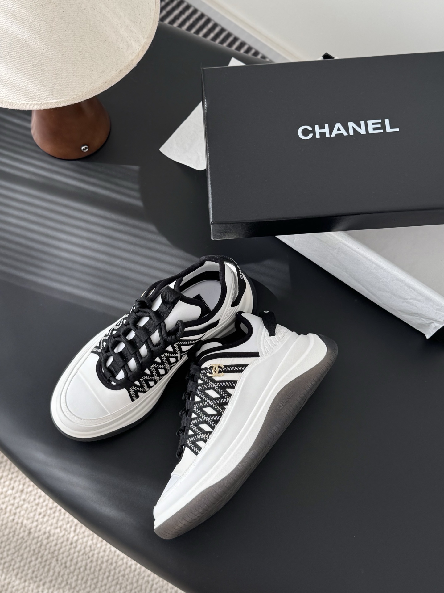 Chanel Luxury Black and White Sneakers with Gold CC Logo