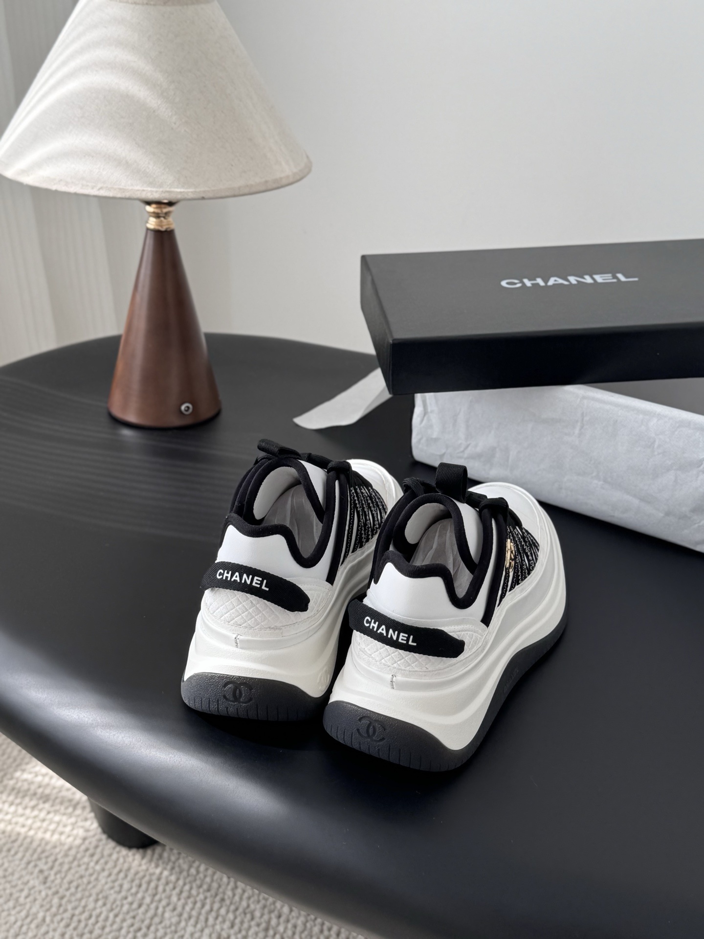 Chanel Luxury Black and White Sneakers with Gold CC Logo