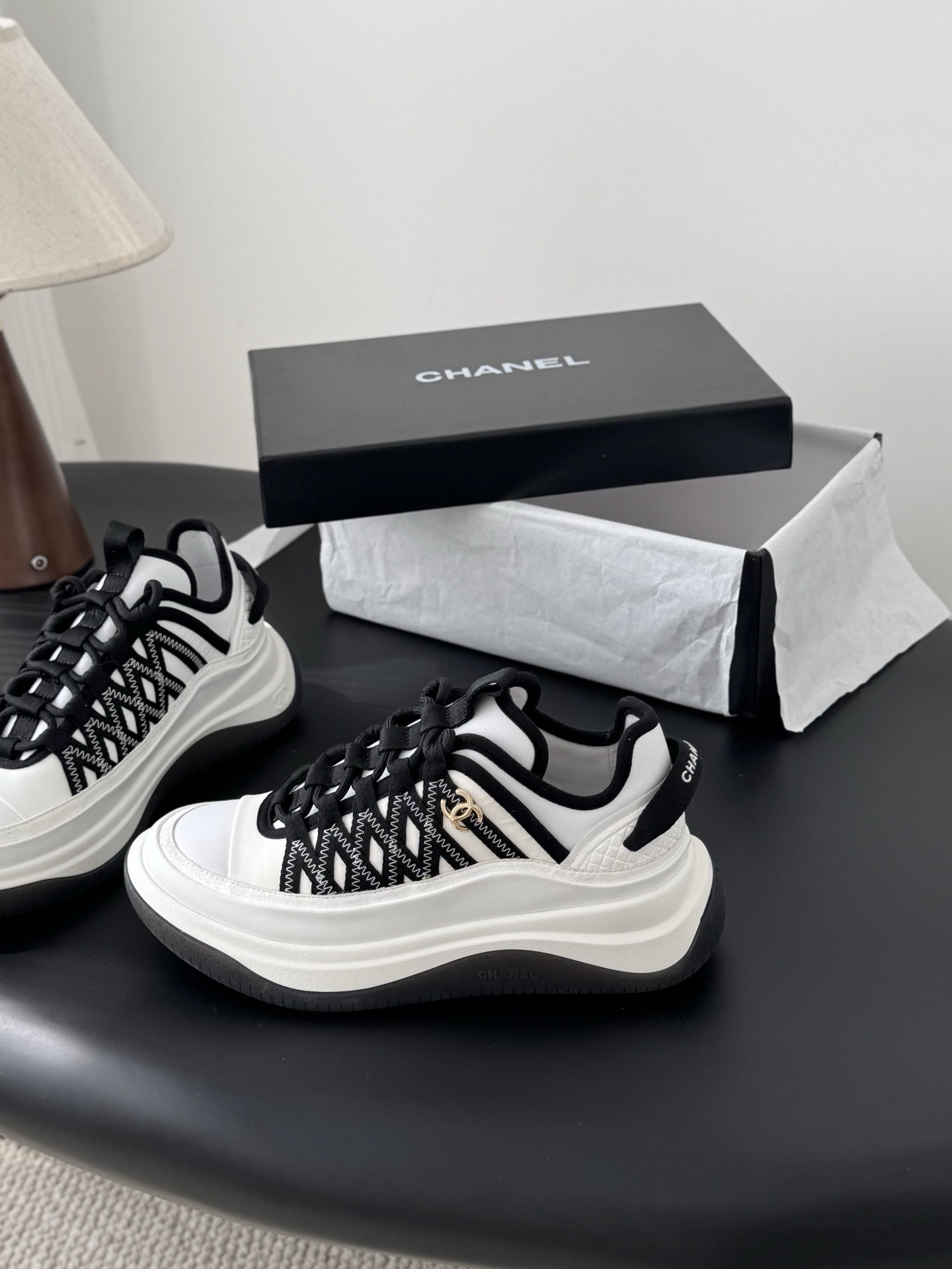Chanel Luxury Black and White Sneakers with Gold CC Logo