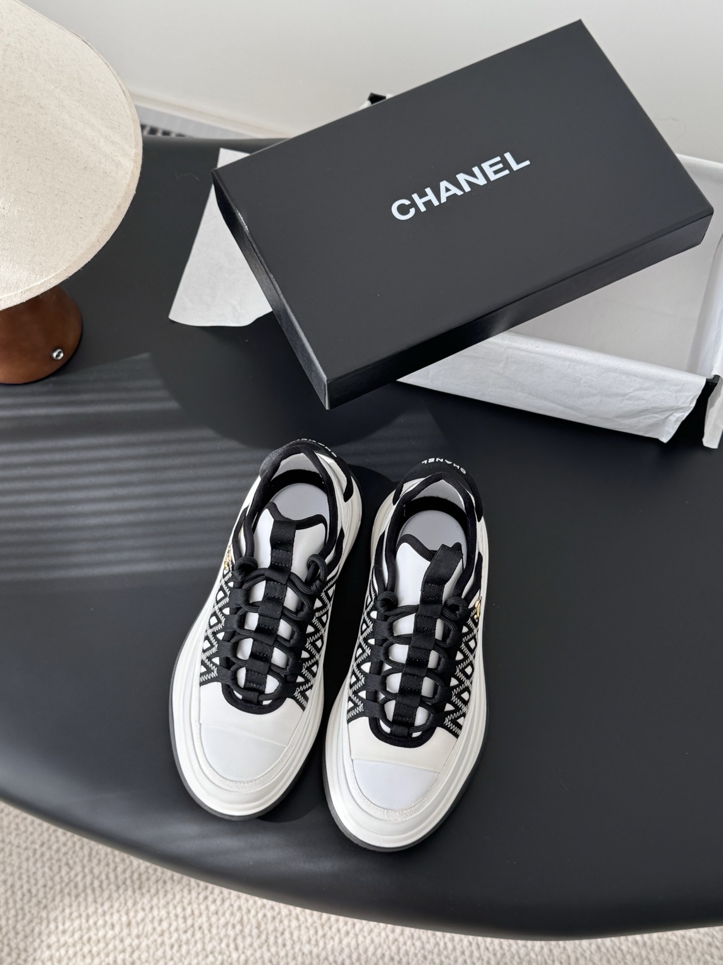 Chanel Luxury Black and White Sneakers with Gold CC Logo