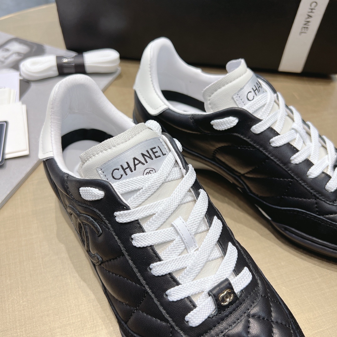 Chanel Women's Quilted Leather Sneakers - Black/White Luxury
