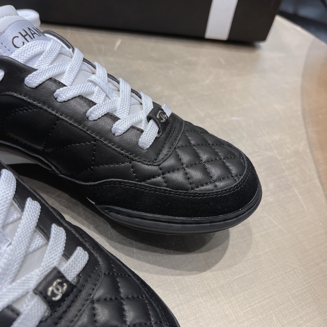 Chanel Women's Quilted Leather Sneakers - Black/White Luxury