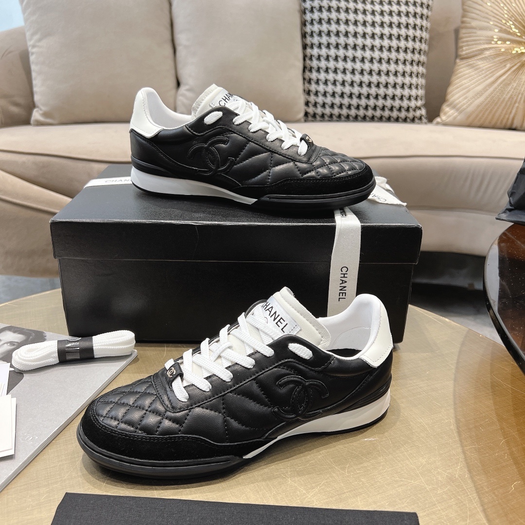 Chanel Women's Quilted Leather Sneakers - Black/White Luxury