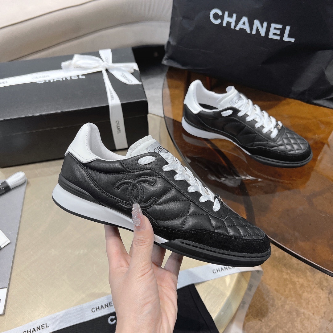 Chanel Women's Quilted Leather Sneakers - Black/White Luxury