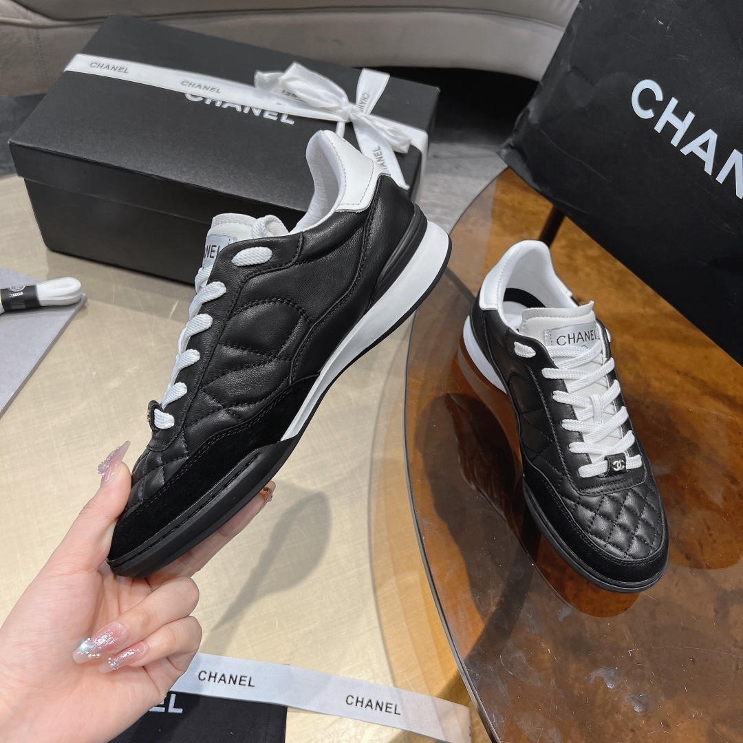 Chanel Women's Quilted Leather Sneakers - Black/White Luxury