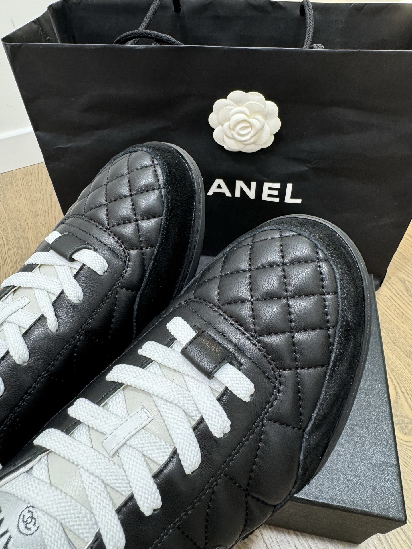 Chanel Black and White Quilted Lambskin Sneakers with CC Logo