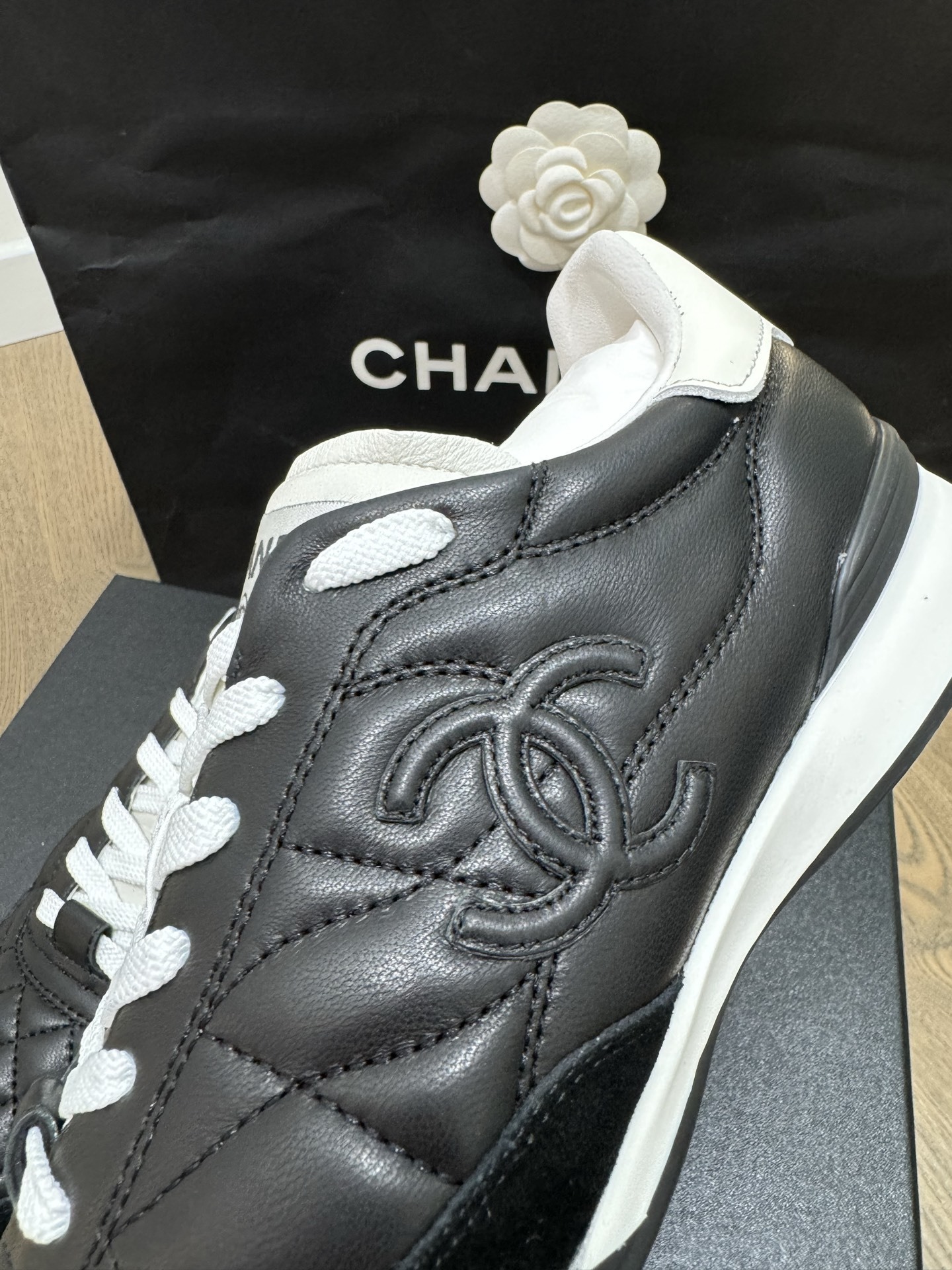 Chanel Black and White Quilted Lambskin Sneakers with CC Logo