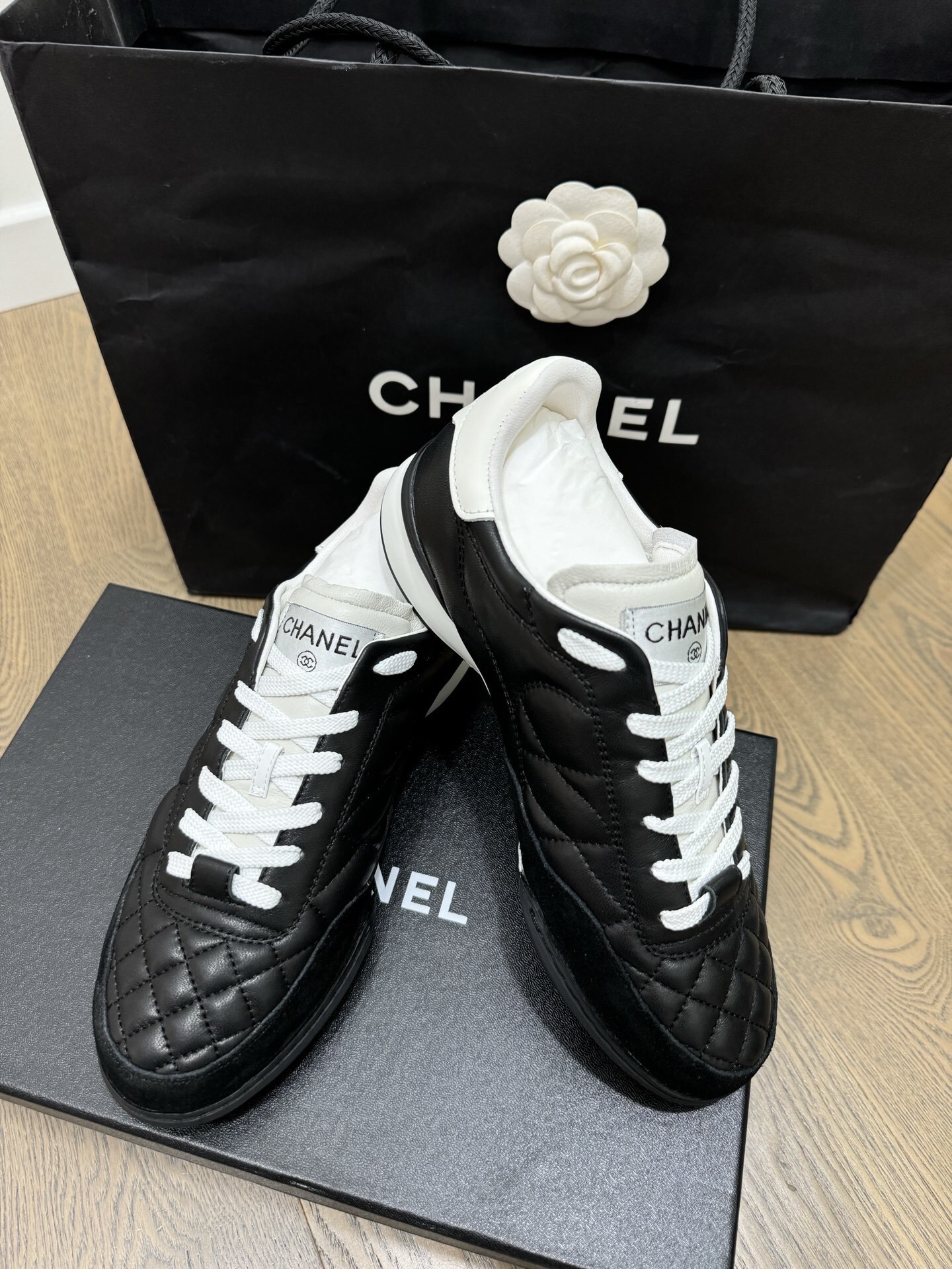 Chanel Black and White Quilted Lambskin Sneakers with CC Logo