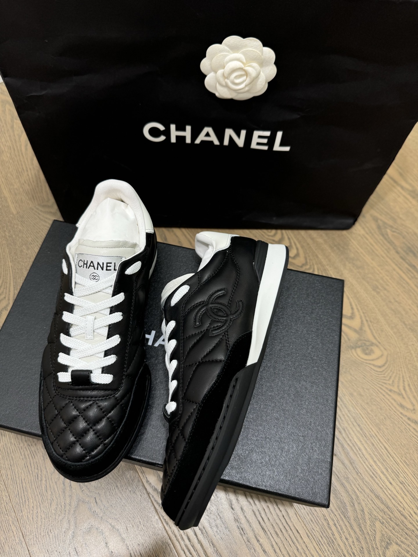 Chanel Black and White Quilted Lambskin Sneakers with CC Logo
