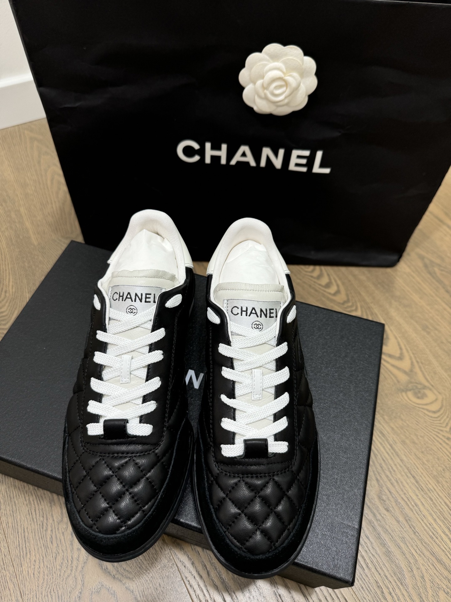 Chanel Black and White Quilted Lambskin Sneakers with CC Logo
