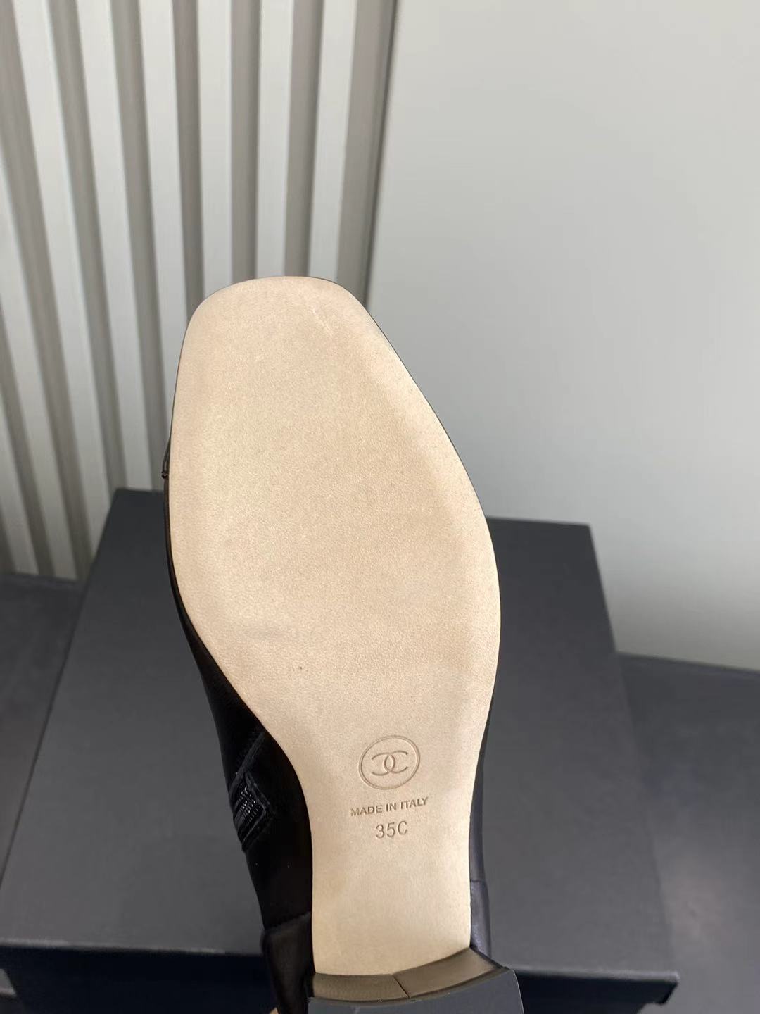 Elegant Black Leather Ankle Boots with Patent Cap Toe & Logo Heel