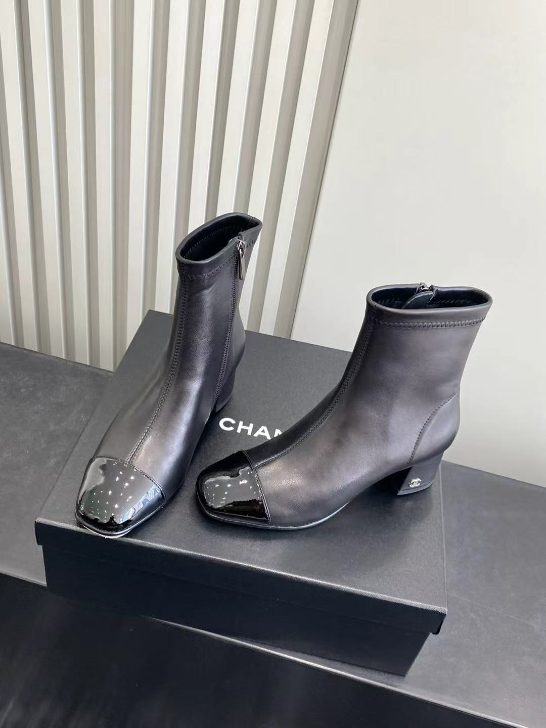 Elegant Black Leather Ankle Boots with Patent Cap Toe & Logo Heel