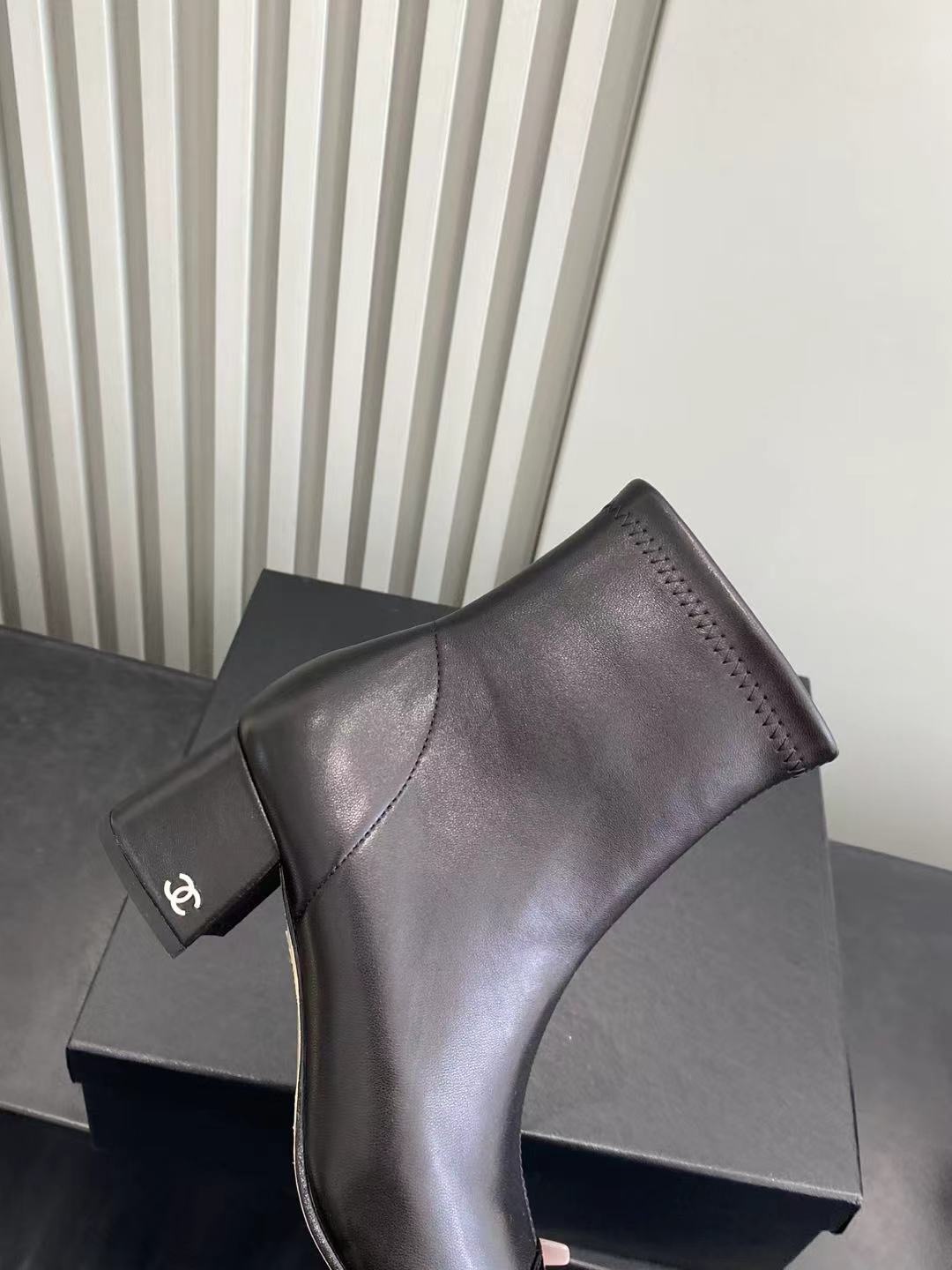 Elegant Black Leather Ankle Boots with Patent Cap Toe & Logo Heel