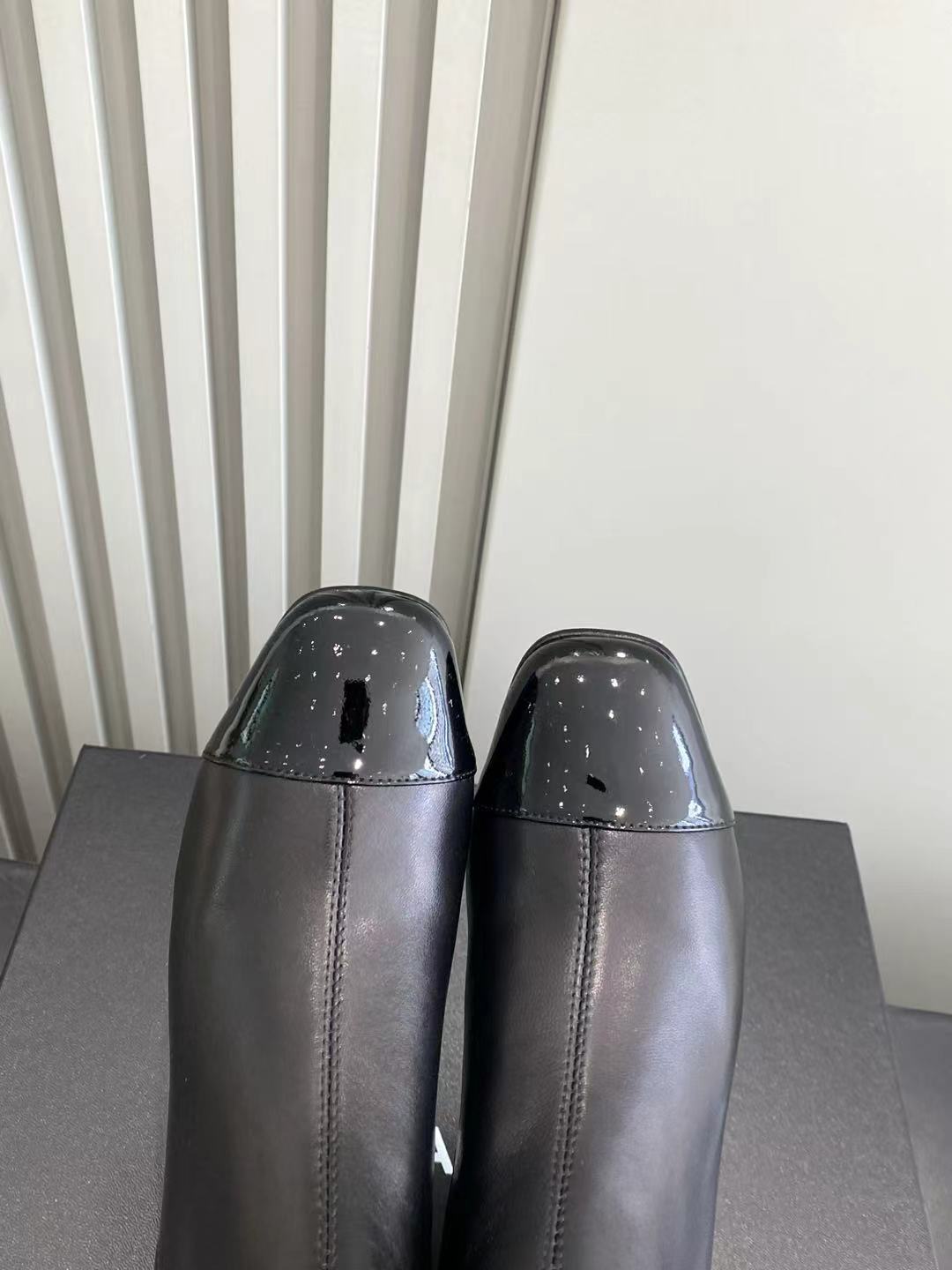 Elegant Black Leather Ankle Boots with Patent Cap Toe & Logo Heel