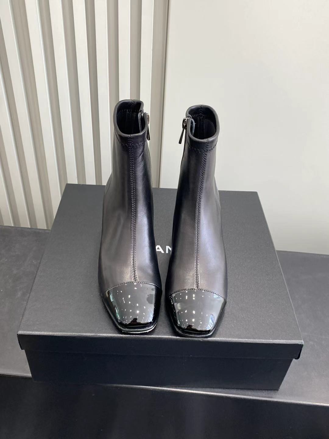 Elegant Black Leather Ankle Boots with Patent Cap Toe & Logo Heel