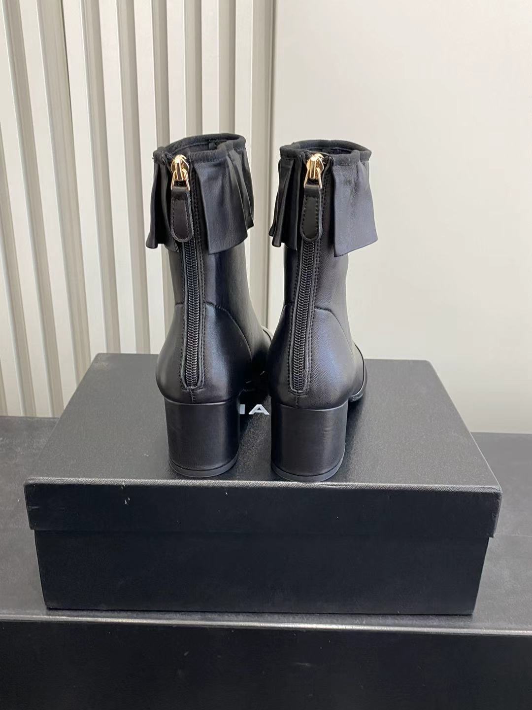 Elegant Black Leather Ruffle Ankle Boots with Patent Cap Toe