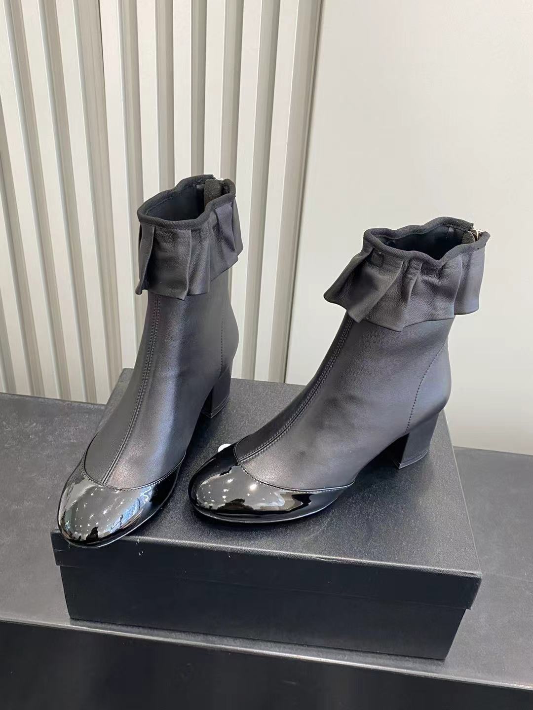 Elegant Black Leather Ruffle Ankle Boots with Patent Cap Toe