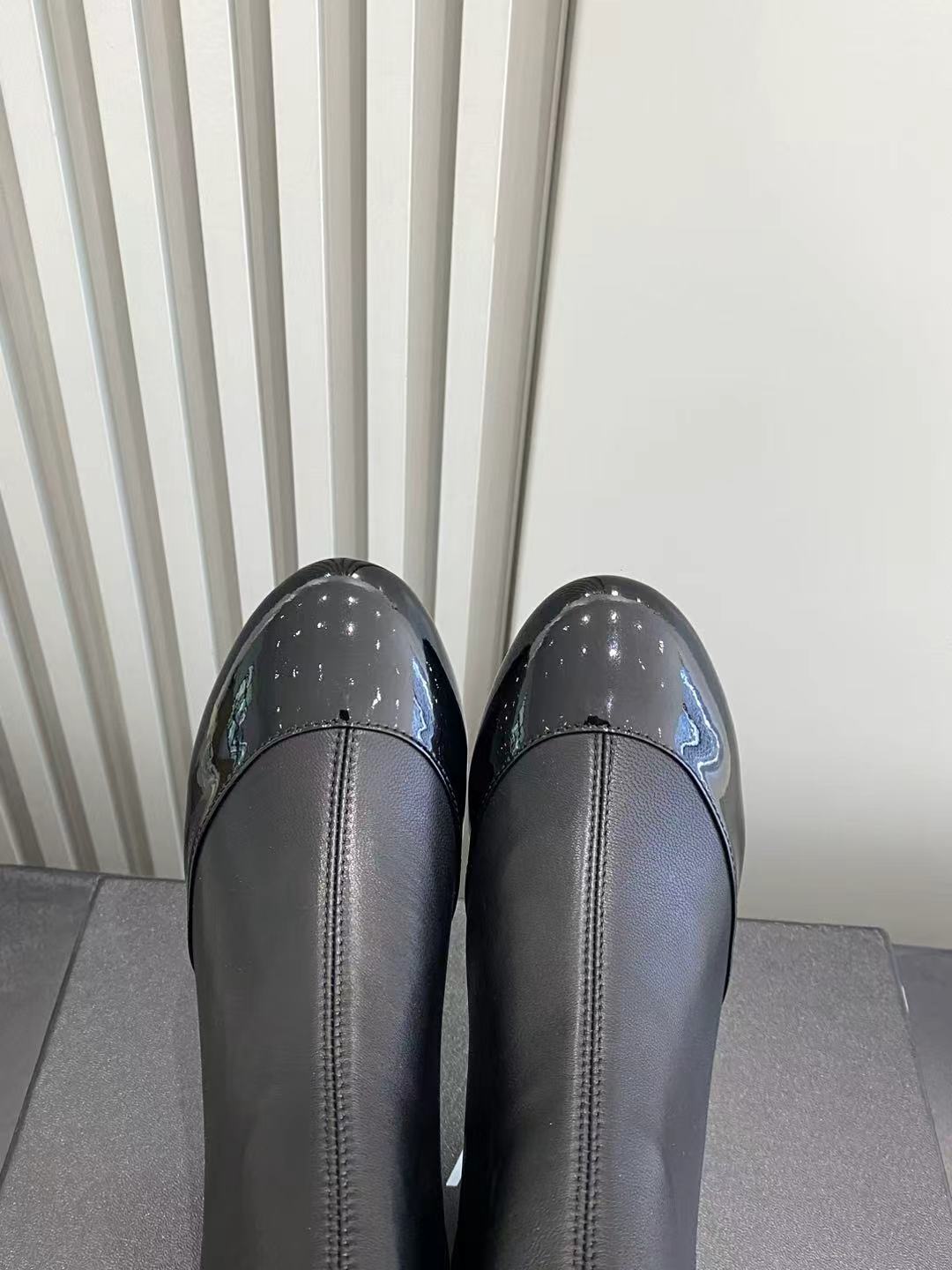 Elegant Black Leather Ruffle Ankle Boots with Patent Cap Toe