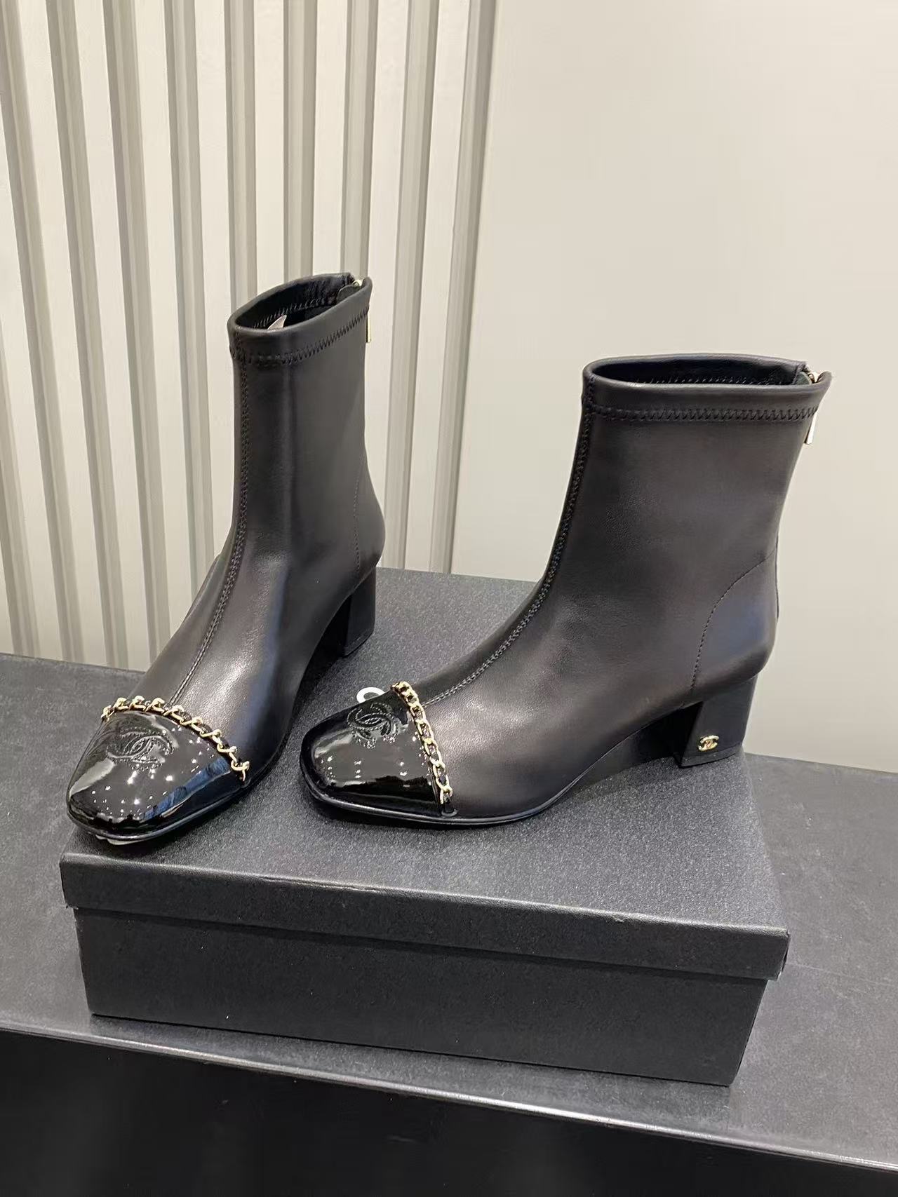 Luxury Black Leather Ankle Boots with Patent Toe & Gold Chain