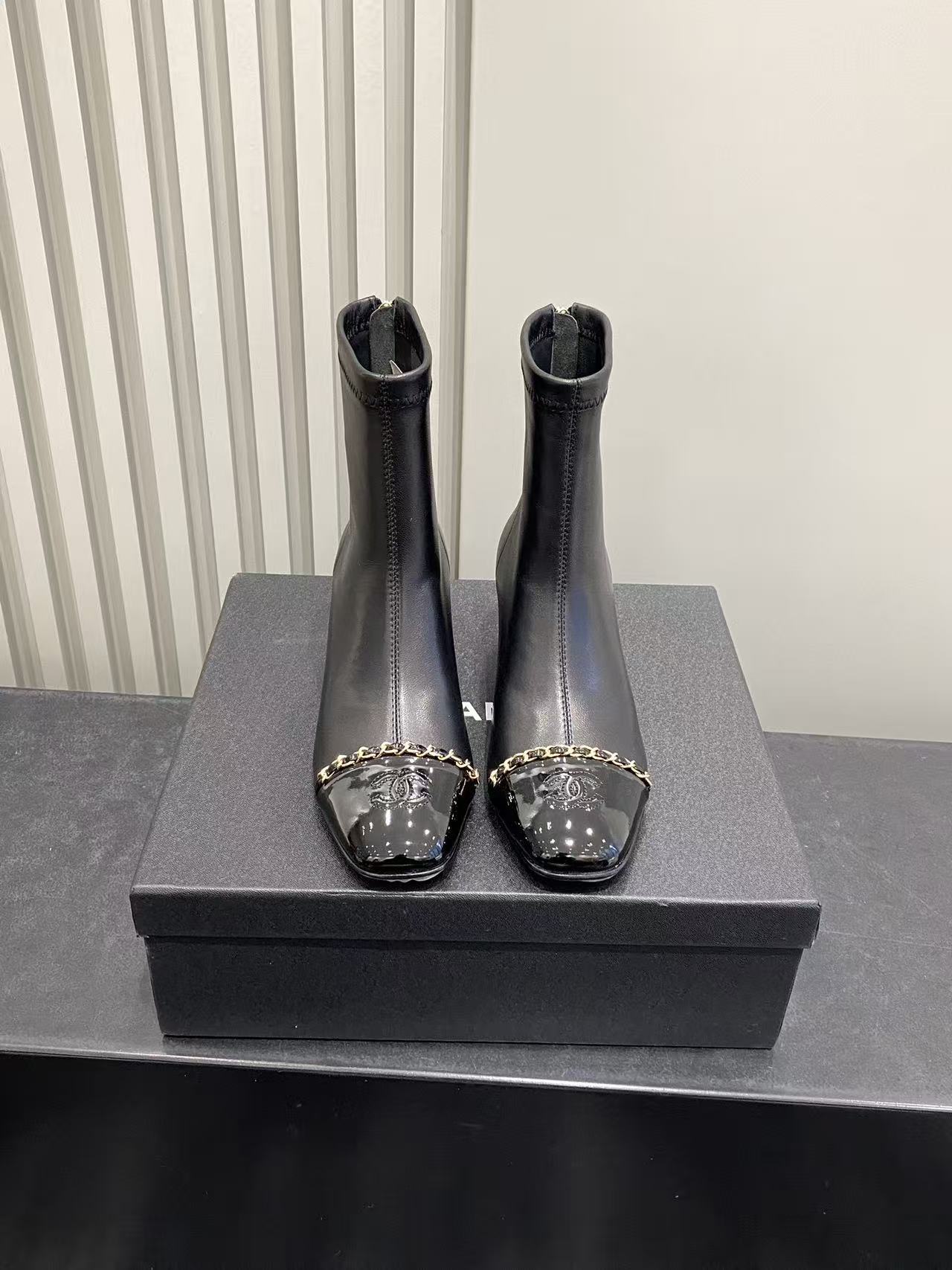 Luxury Black Leather Ankle Boots with Patent Toe & Gold Chain