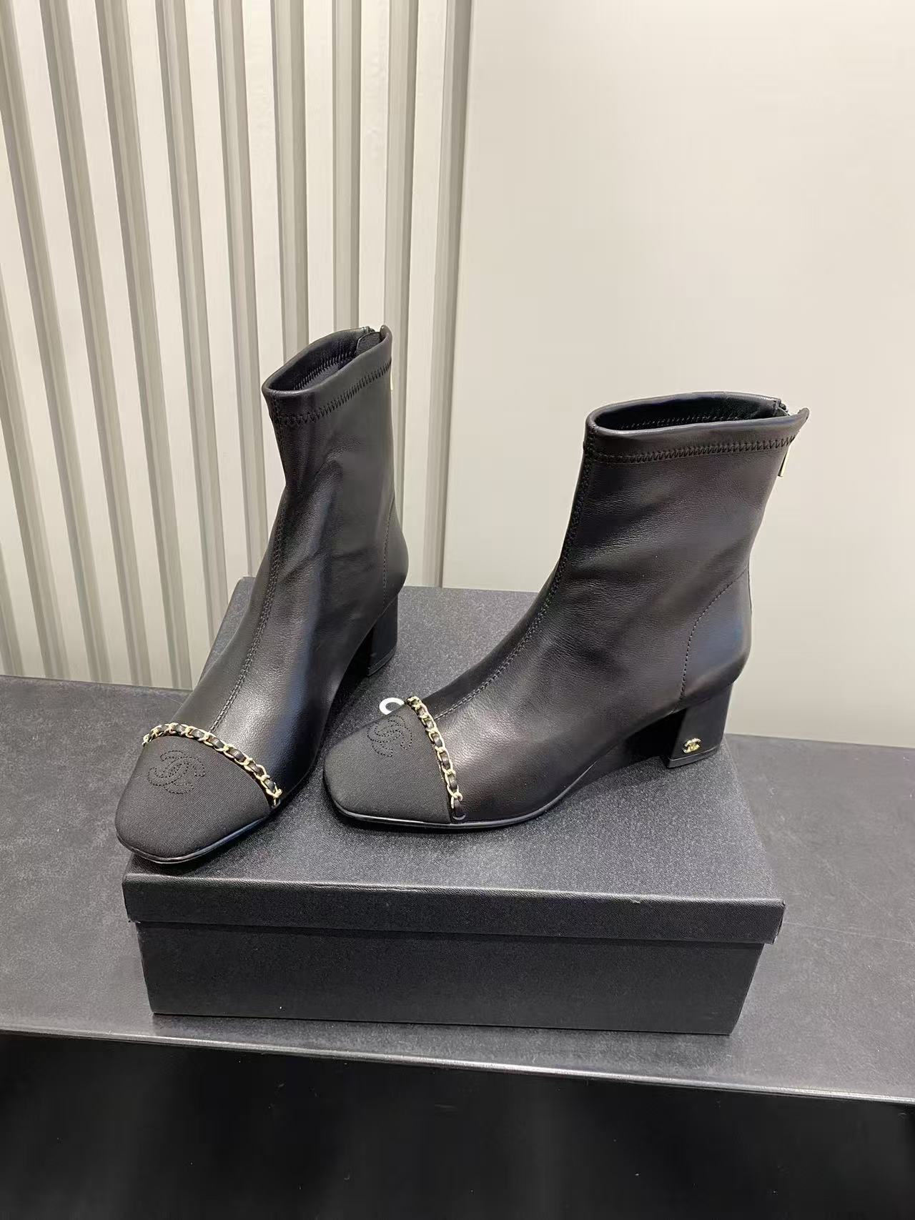 Chanel Black Leather Ankle Boots with Gold Chain and Block Heel