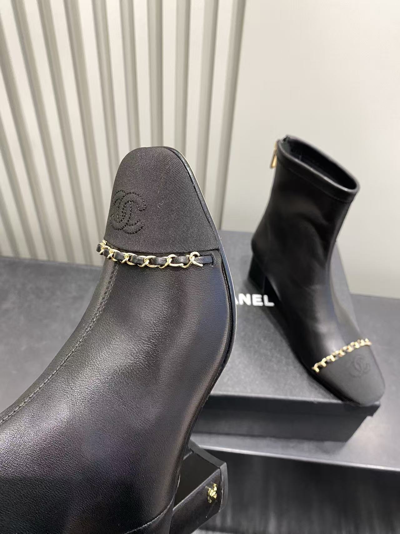 Chanel Black Leather Ankle Boots with Gold Chain and Block Heel