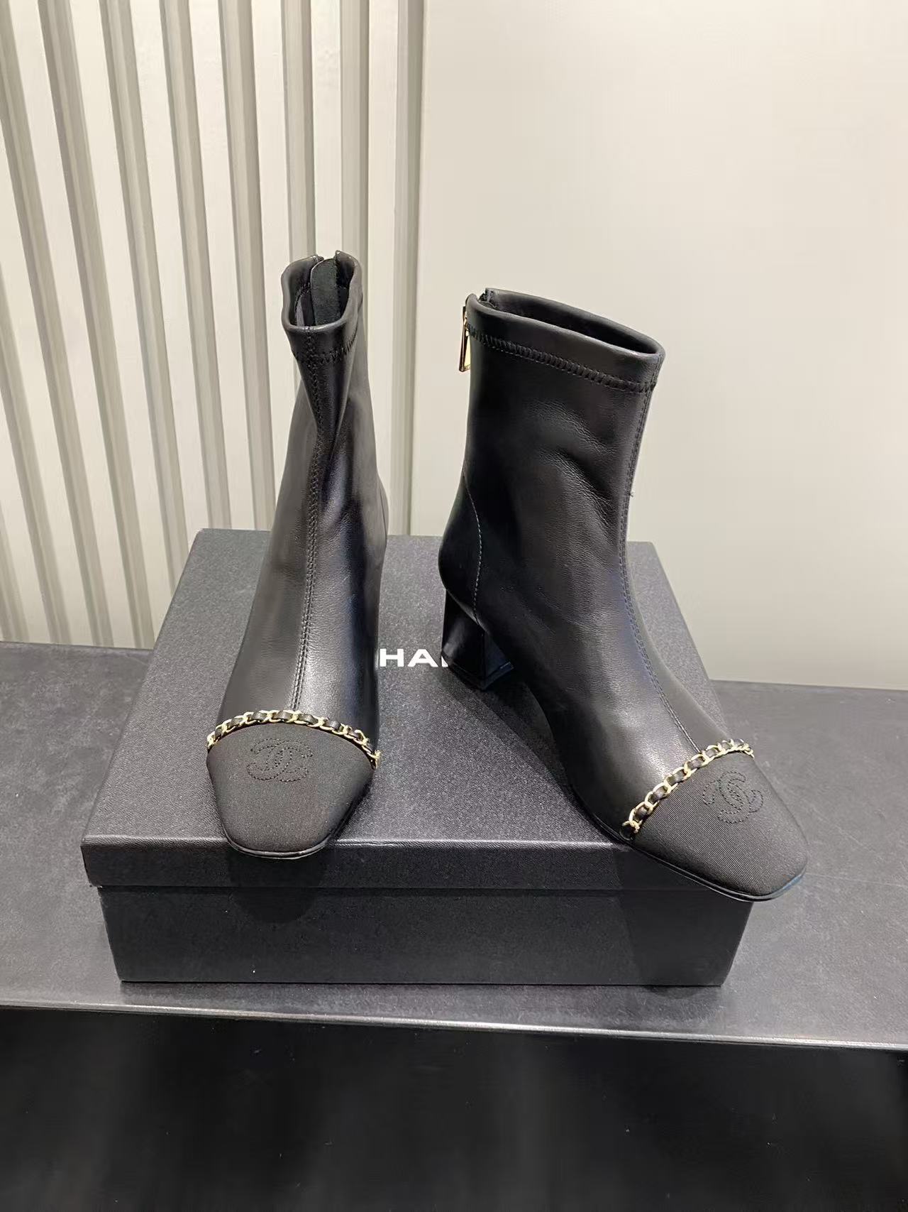 Chanel Black Leather Ankle Boots with Gold Chain and Block Heel