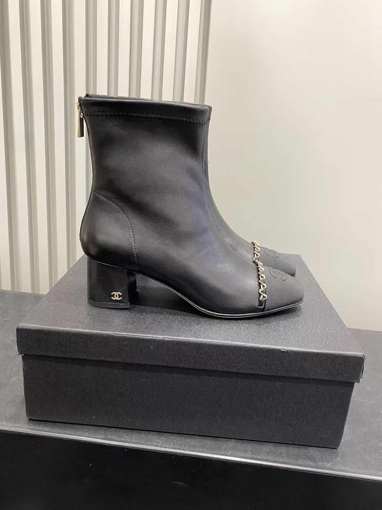 Chanel Black Leather Ankle Boots with Gold Chain and Block Heel