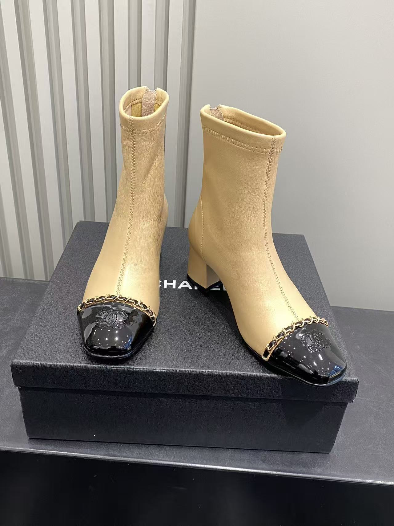 Luxury Beige Leather Cap Toe Ankle Boots with Gold Chain Detail