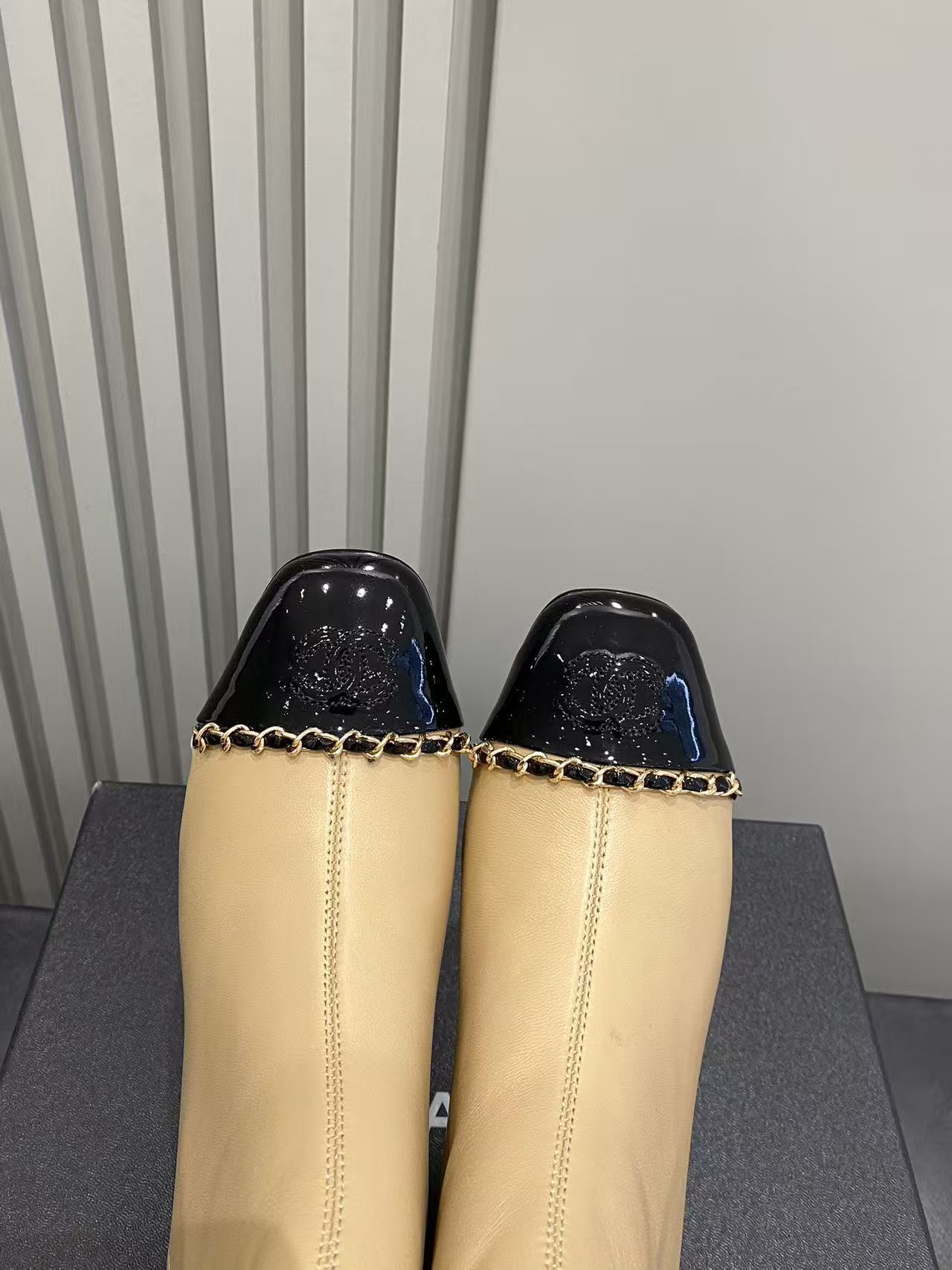 Luxury Beige Leather Cap Toe Ankle Boots with Gold Chain Detail