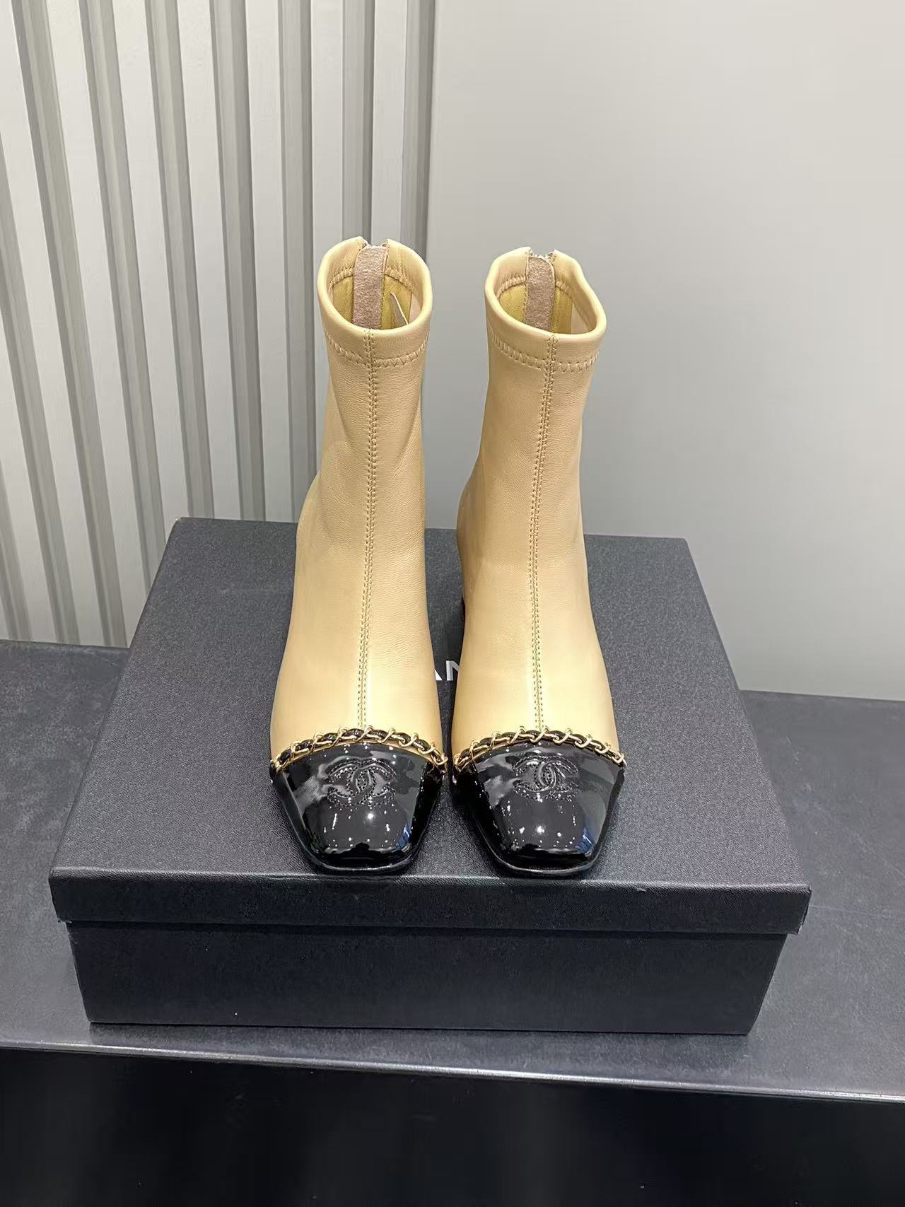 Luxury Beige Leather Cap Toe Ankle Boots with Gold Chain Detail