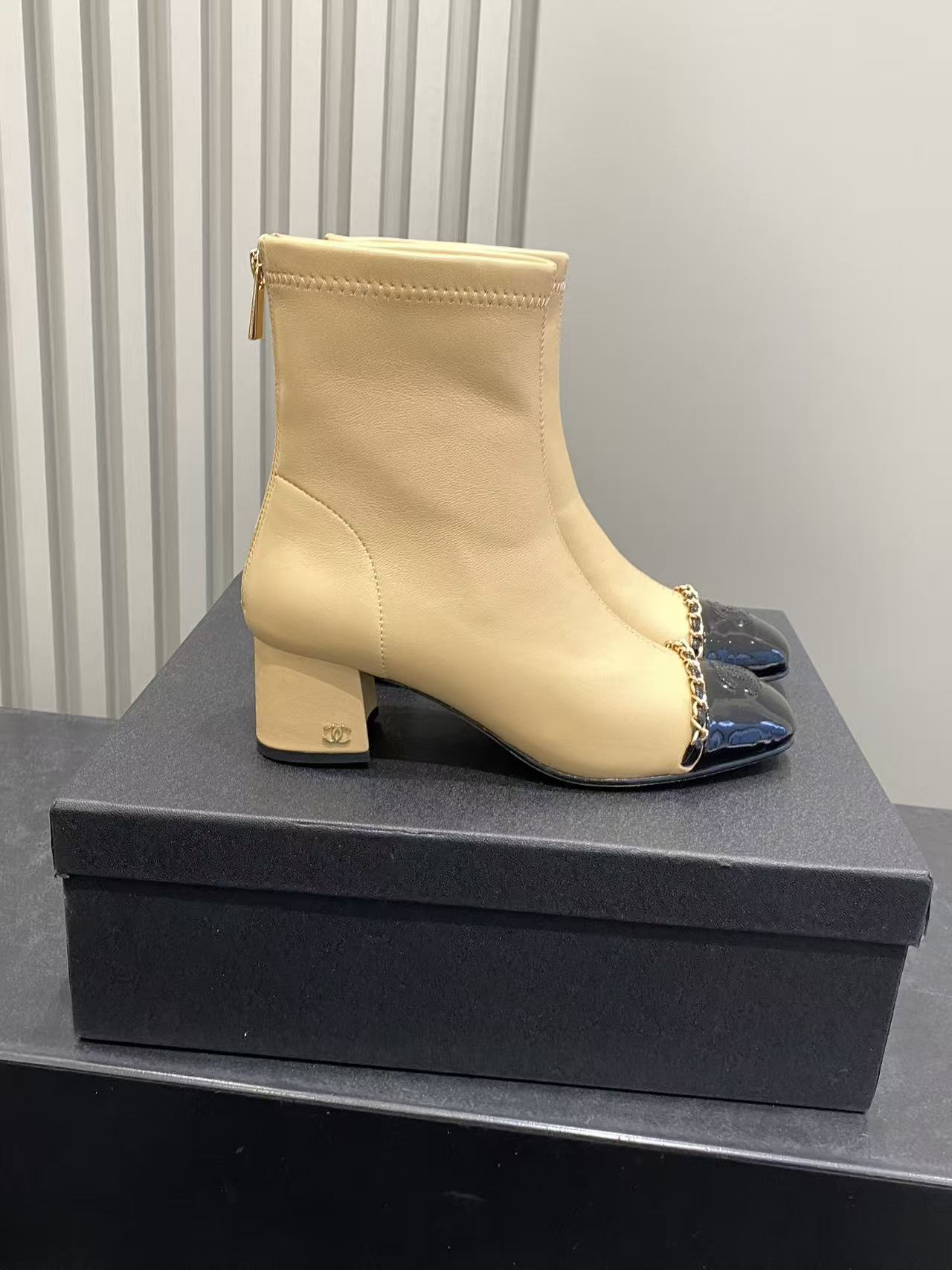 Luxury Beige Leather Cap Toe Ankle Boots with Gold Chain Detail